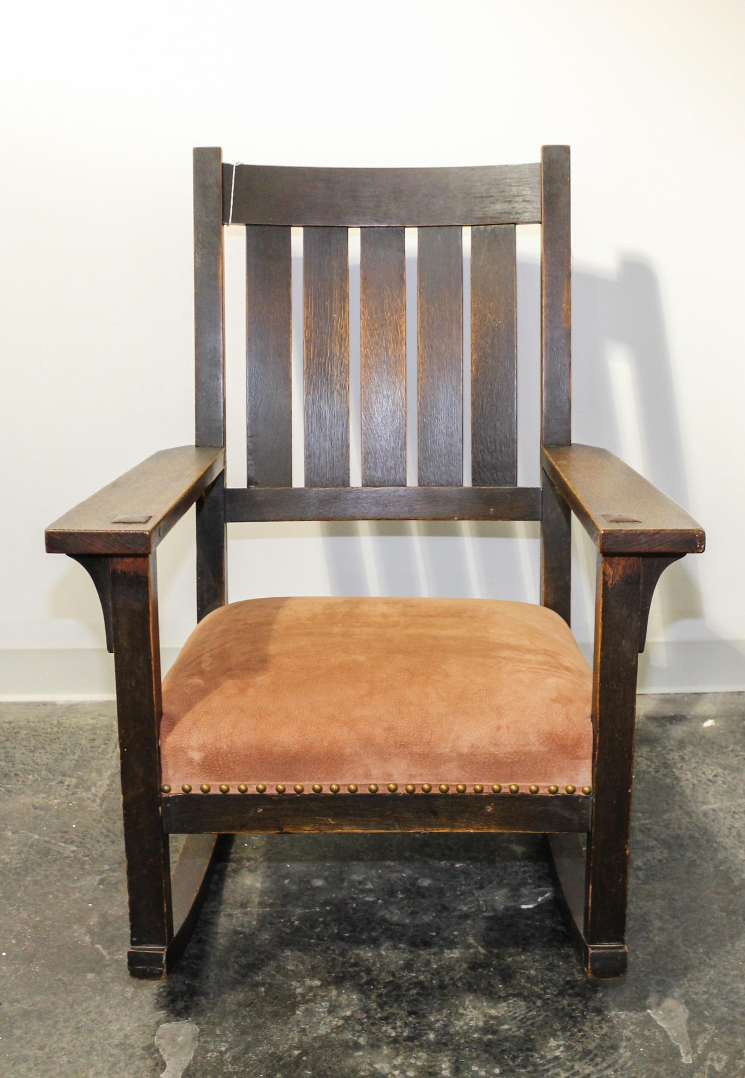 A Stickley Oak Rocking Chair. Height 37 1/4 inches.