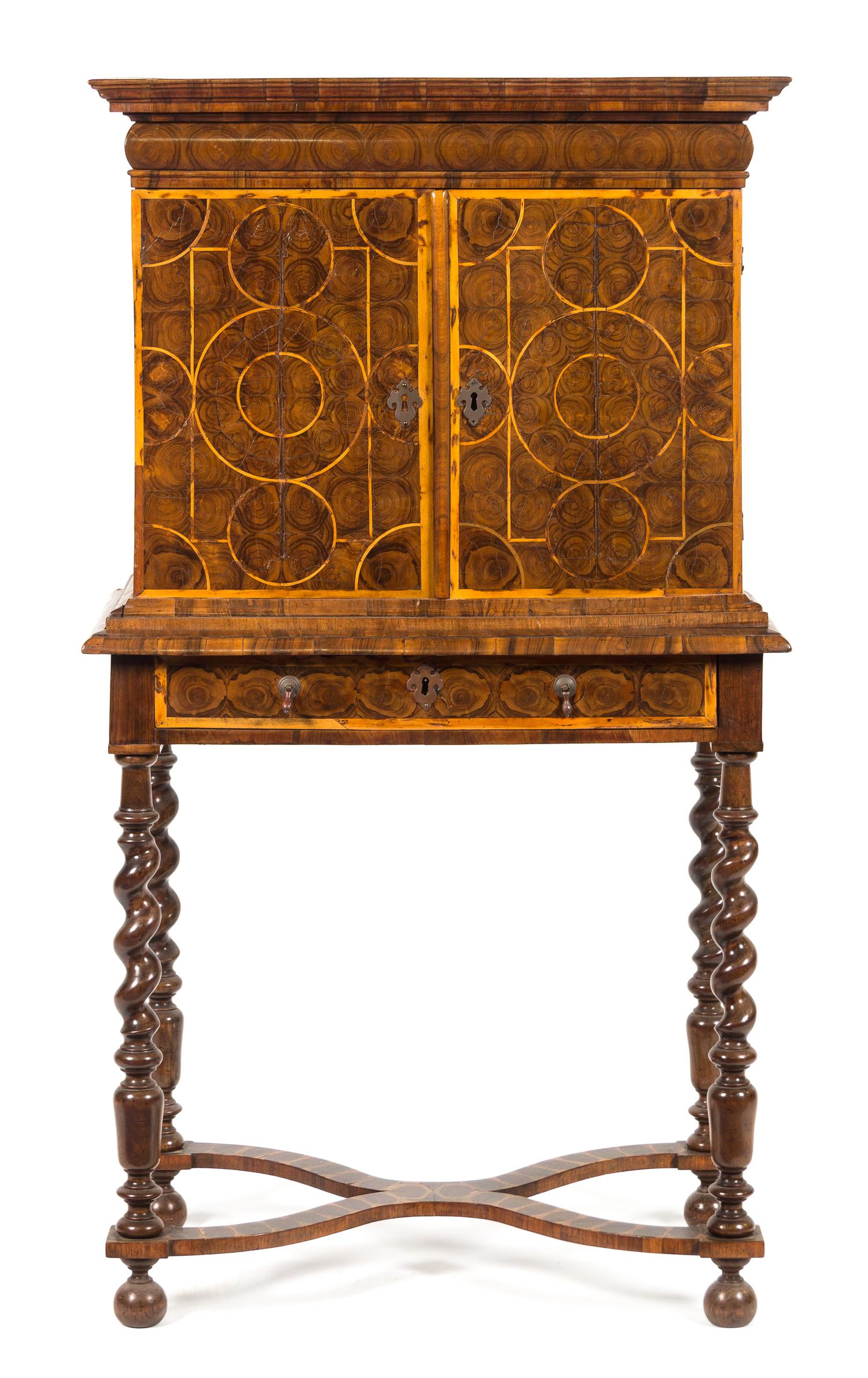 A William & Mary Oysterwood Cabinet on Stand Height 54 1/2 x width 29 1/2 x depth 18 1/4 inches. — 17TH CENTURY