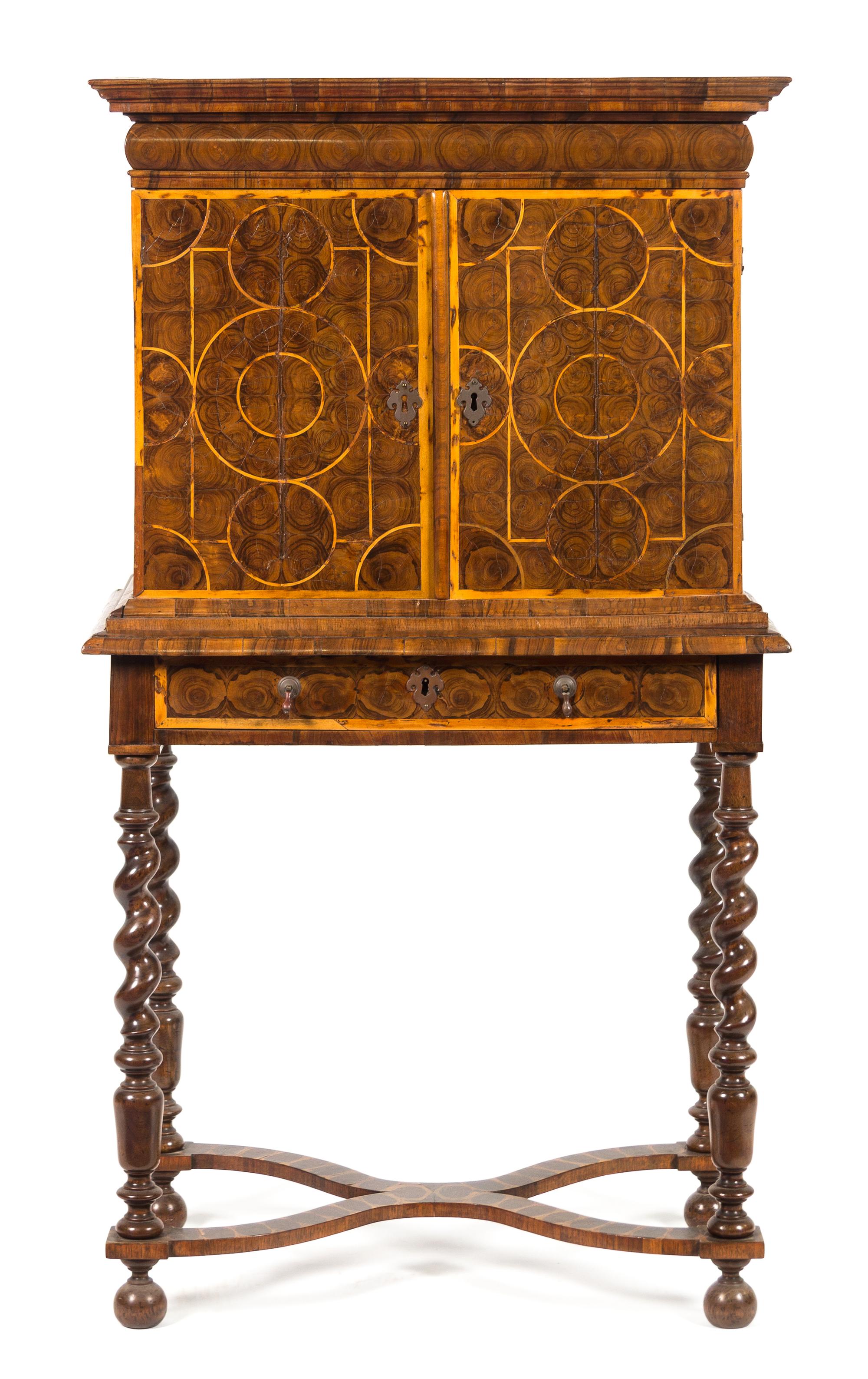 A William & Mary Oysterwood Cabinet on Stand Height 54 1/2 x width 29 1/2 x depth 18 1/4 inches. — 17TH CENTURY