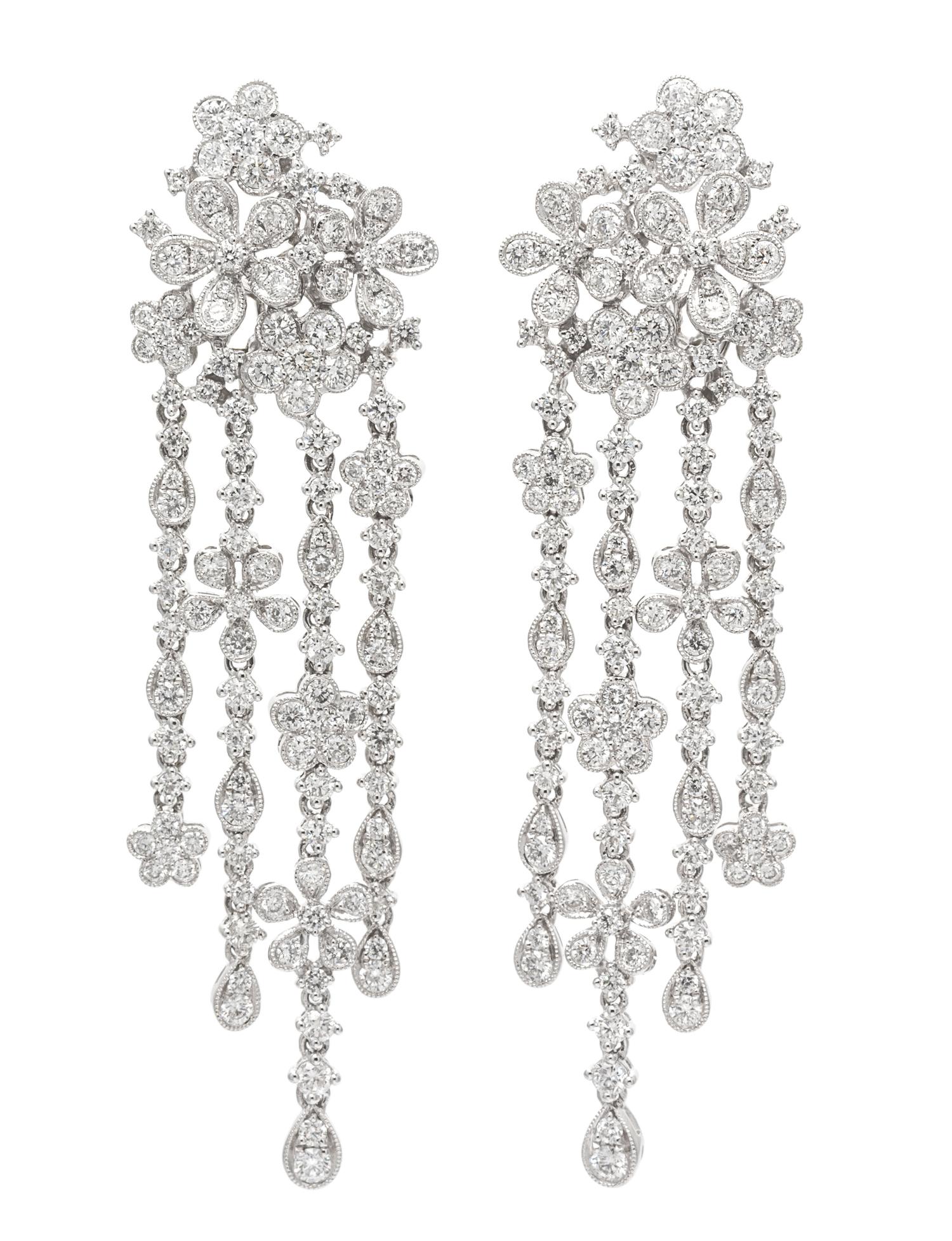 A Pair of 18 Karat White Gold and Diamond Floral Cluster Fringe Earclips, 12.90 dwts.
