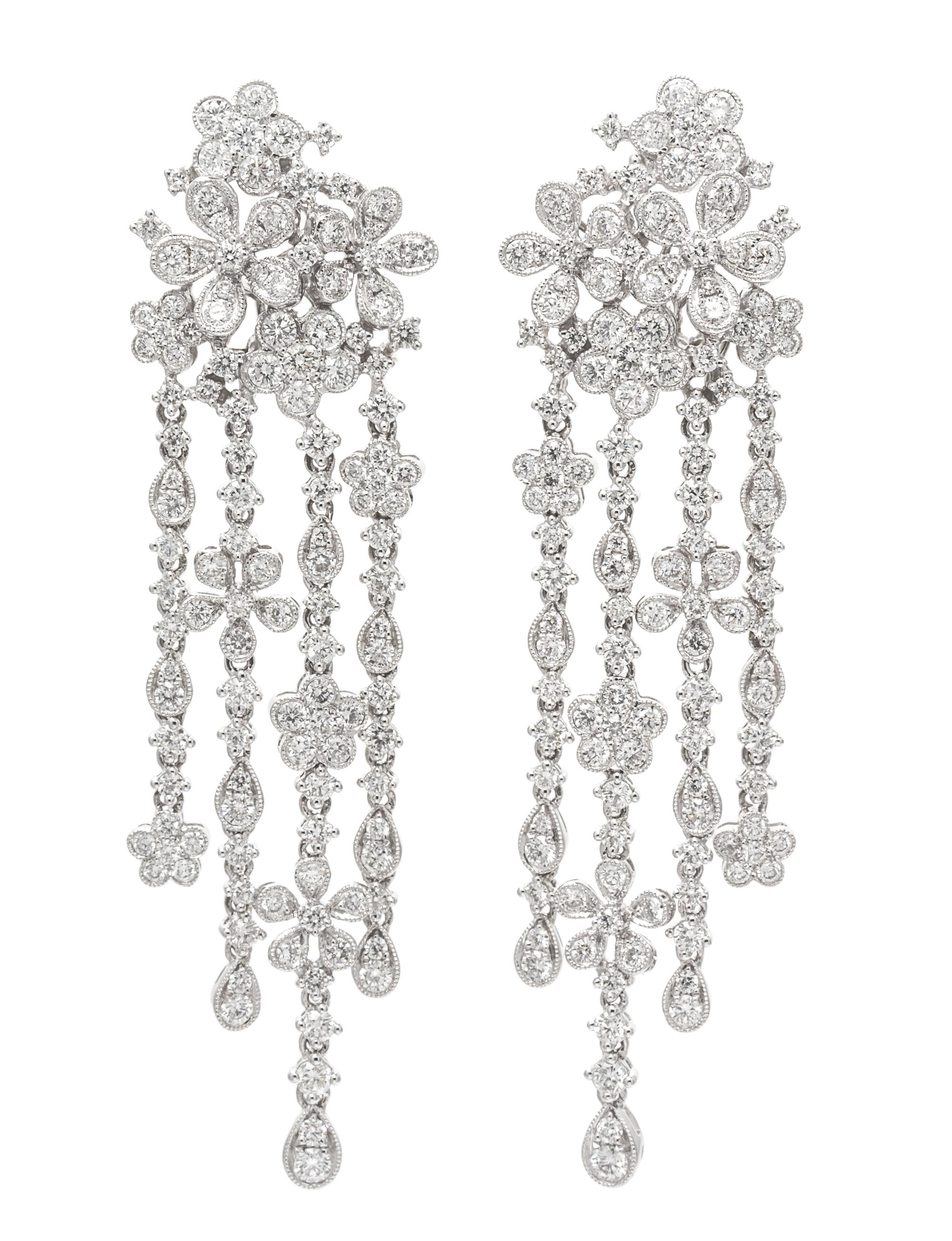 A Pair of 18 Karat White Gold and Diamond Floral Cluster Fringe Earclips, 12.90 dwts.