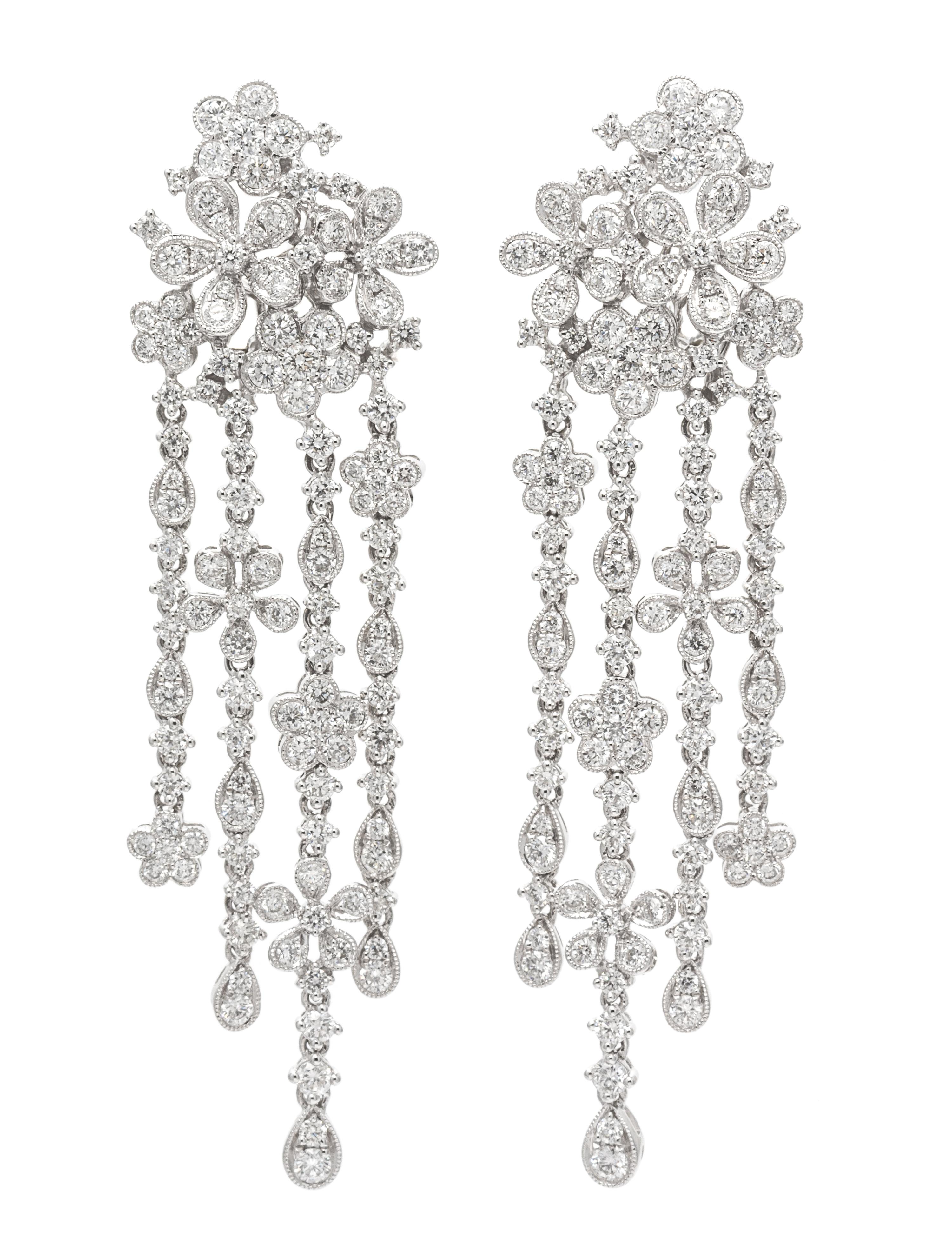 A Pair of 18 Karat White Gold and Diamond Floral Cluster Fringe Earclips, 12.90 dwts.