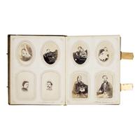 [Civil War]. A group of Civil War-era CDV albums and post-war reunion badges.