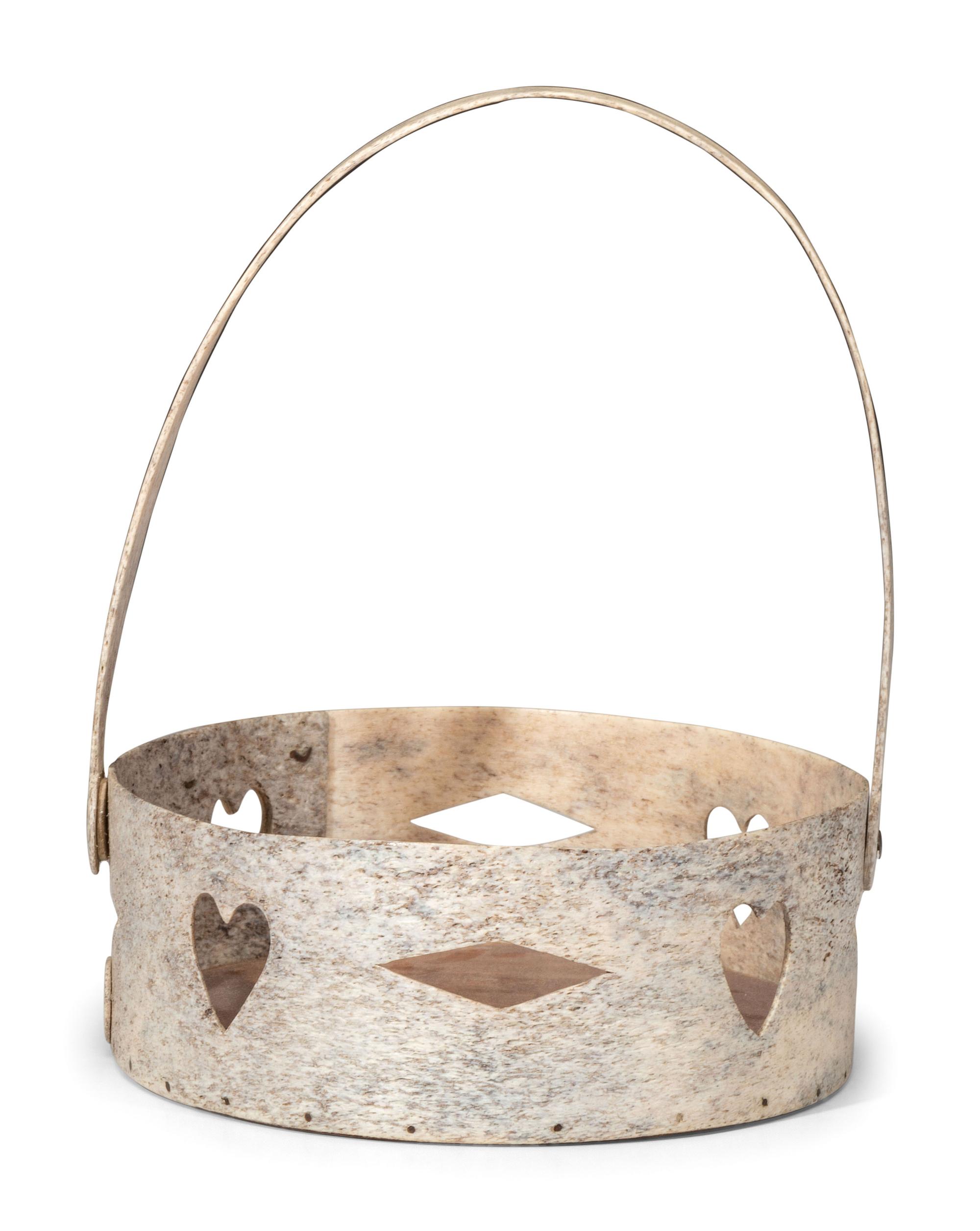 A Carved and Pierced Whale Bone Swing-Handle Basket