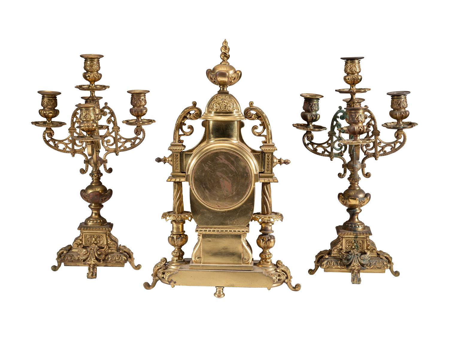 A Continental Gilt Bronze Three-Piece Clock Garniture