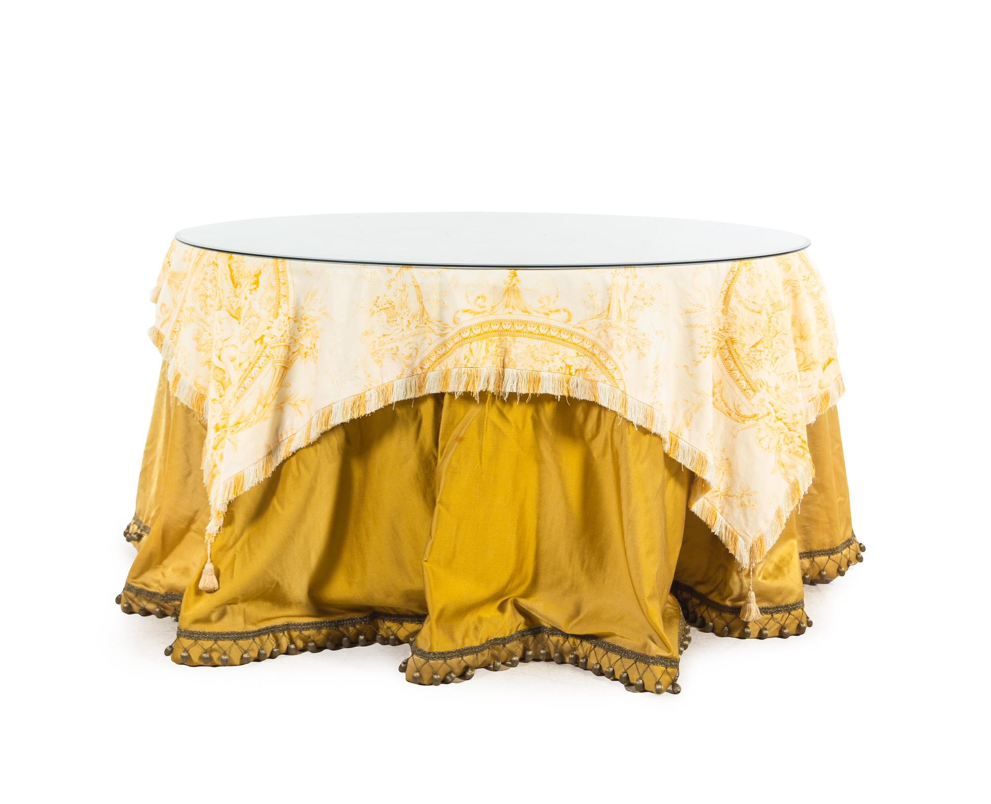 A Glass-Topped Silk Skirted Dining Table with a Fortuny Cover