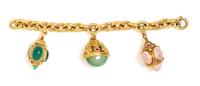 An 18 Karat Yellow Gold Charm Bracelet with Three Gold and Gem Pendant Charms, 74.30 dwts.