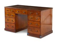 An Edwardian Walnut Partners Desk