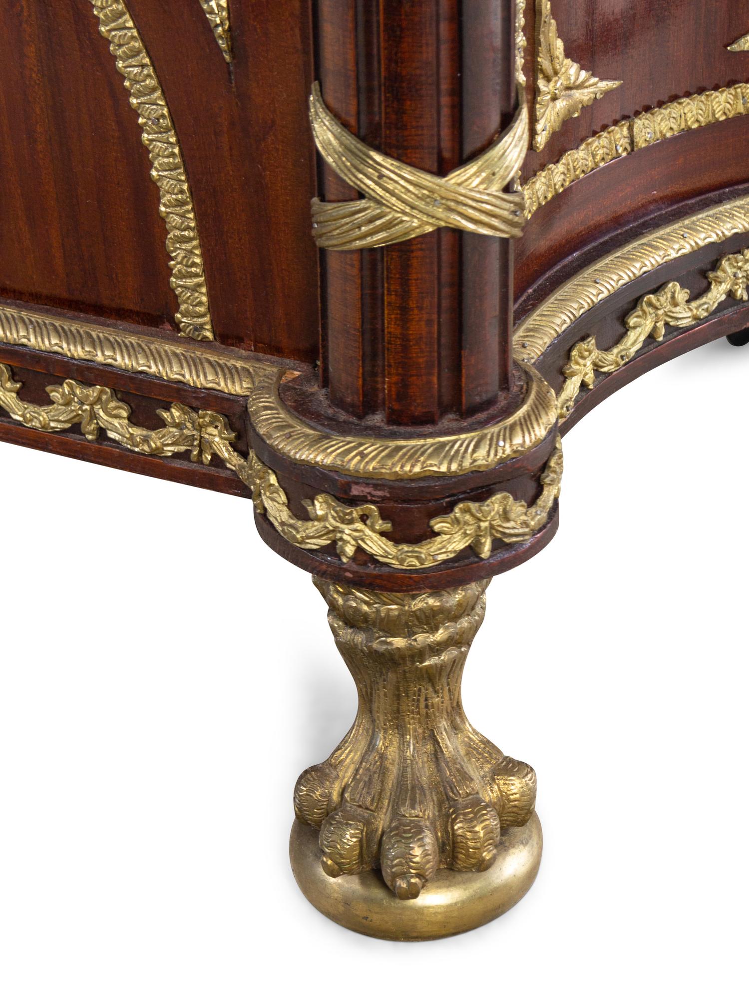 A Louis XVI Style Gilt Metal Mounted Mahogany Commode à Vantaux After the Model by Guillaume Benneman