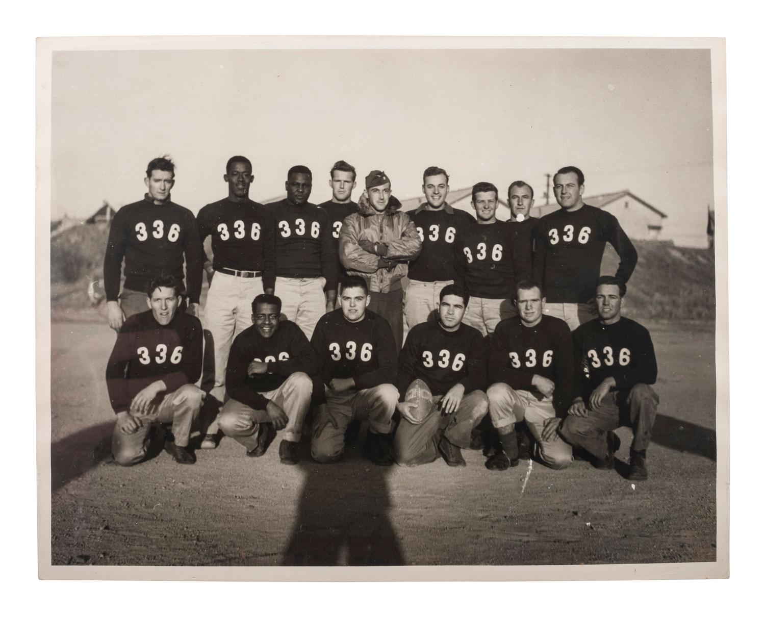 [WORLD WAR II & VIETNAM]. A group of 14 snapshots including portraits of prize fighter Toikey Thompson and black female combat nurses, including: