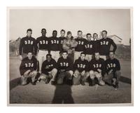 [WORLD WAR II & VIETNAM]. A group of 14 snapshots including portraits of prize fighter Toikey Thompson and black female combat nurses, including: