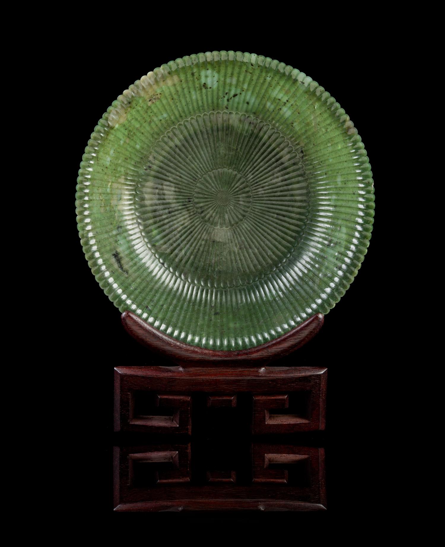 A Chinese Spinach Jade Mughal-Style Chrysanthemum Dish LATE QING DYNASTY, 19TH CENTURY Diameter 7 1/2 inches. — LATE QING DYNASTY, 19TH CENTURY