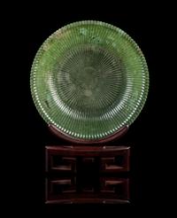 A Chinese Spinach Jade Mughal-Style Chrysanthemum Dish LATE QING DYNASTY, 19TH CENTURY Diameter 7 1/2 inches. — LATE QING DYNASTY, 19TH CENTURY