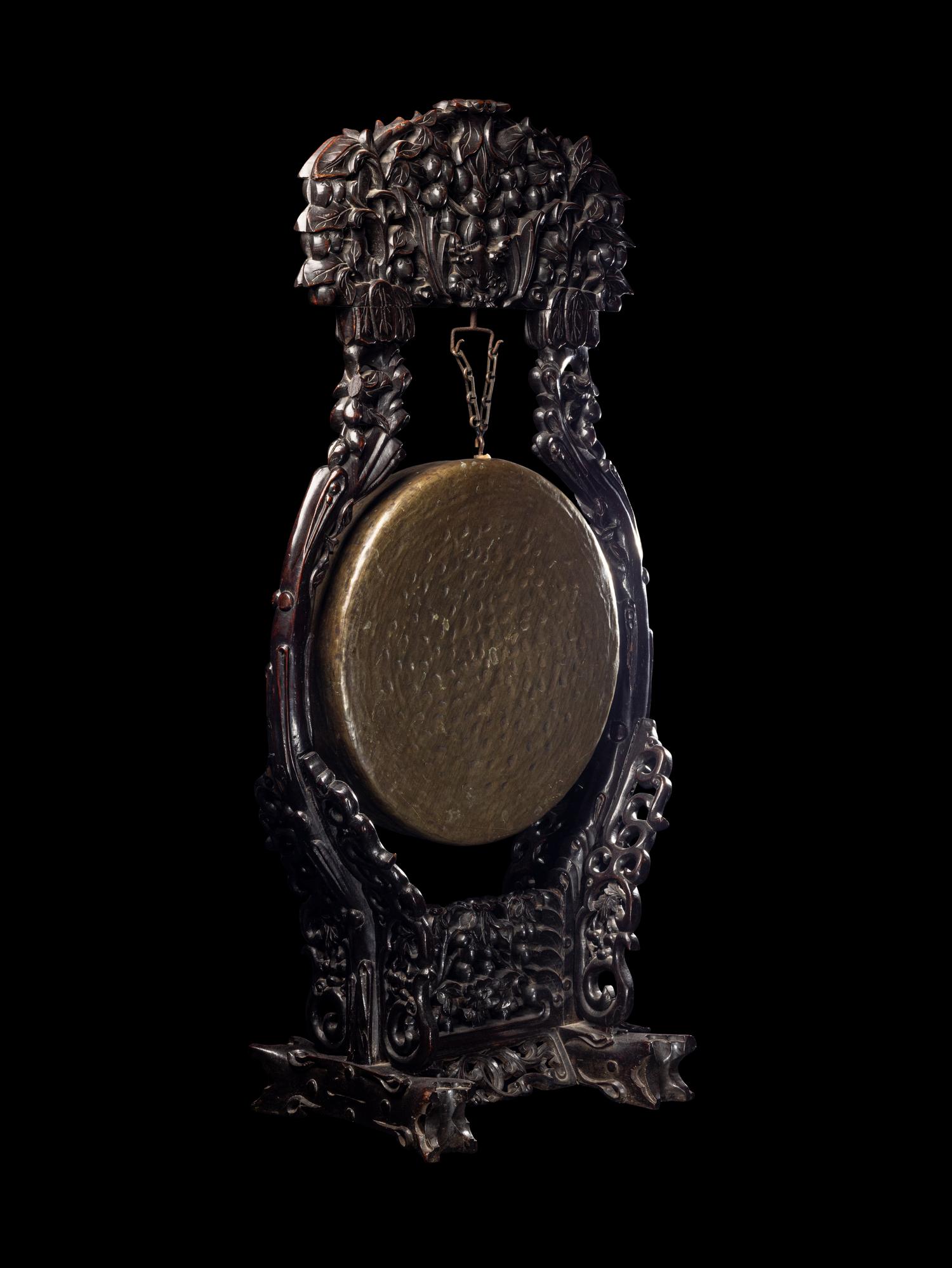 A Large Chinese Bronze Gong with a Carved Rosewood Stand