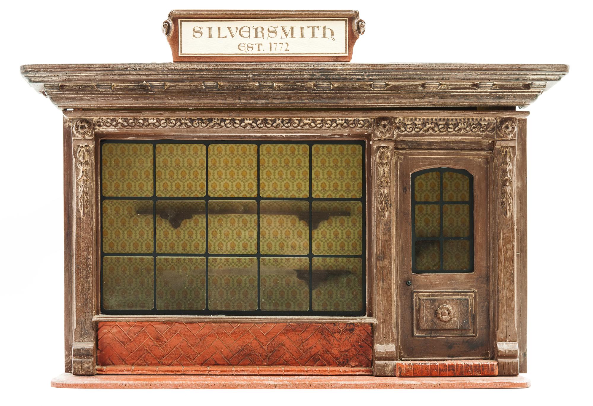 A Georgian Style Silversmith's Shop Display Height 12 x width 17 1/2 x depth 7 1/4 inches. — 20TH CENTURY