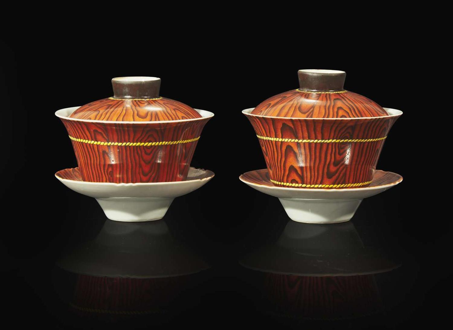 A pair of Chinese faux bois porcelain erotic tea bowls, covers, and stands 仿木紋春宮茶盞兩套