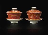 A pair of Chinese faux bois porcelain erotic tea bowls, covers, and stands 仿木紋春宮茶盞兩套