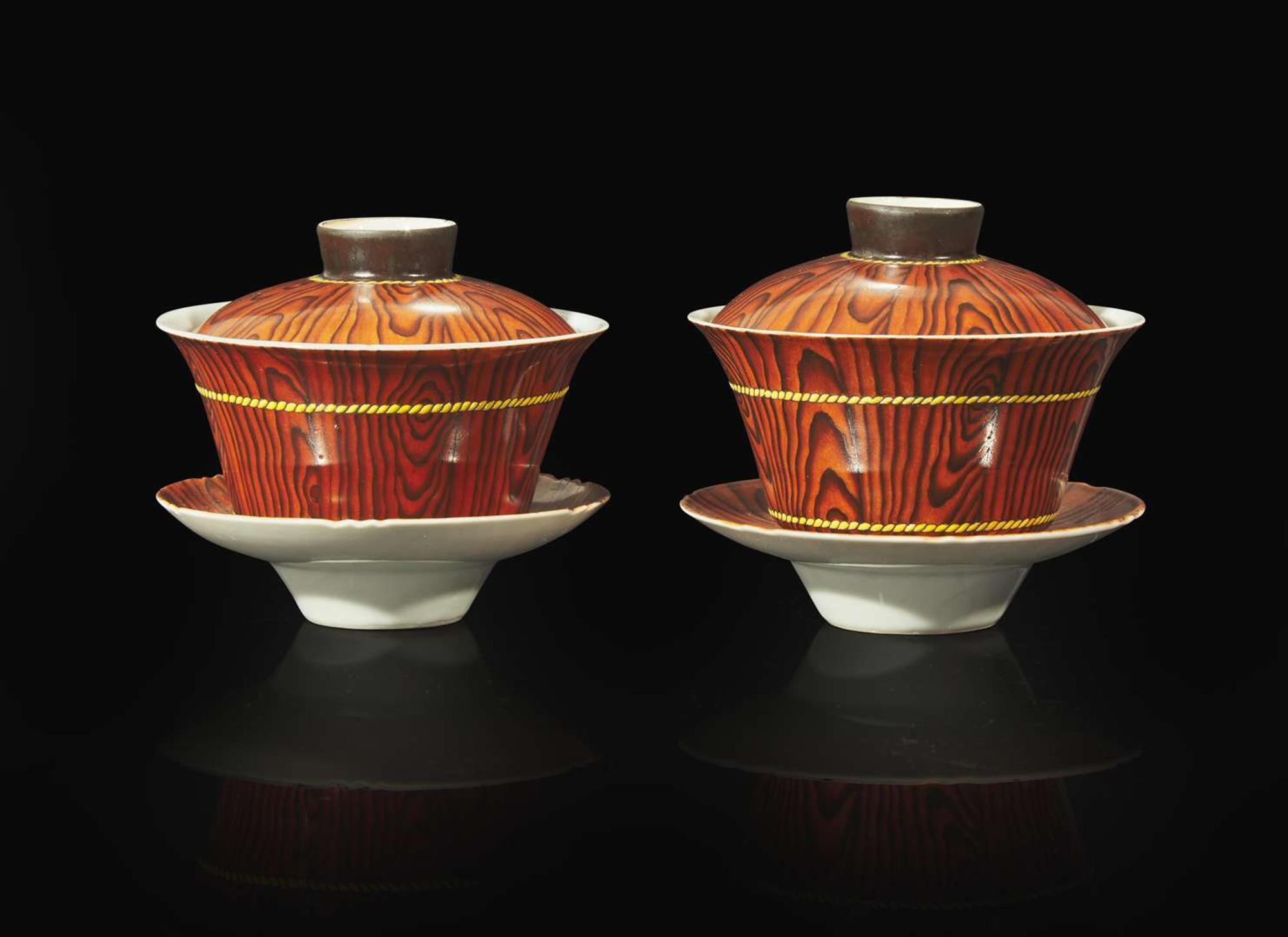 A pair of Chinese faux bois porcelain erotic tea bowls, covers, and stands 仿木紋春宮茶盞兩套