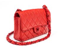 A Chanel Red Lambskin Quilted Flap Bag, 10" x 7" x 2.75"; Strap drop: 19".