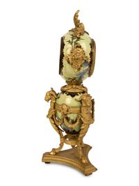 A French Gilt Bronze and Glazed Pottery Clock — LATE 19TH CENTURY