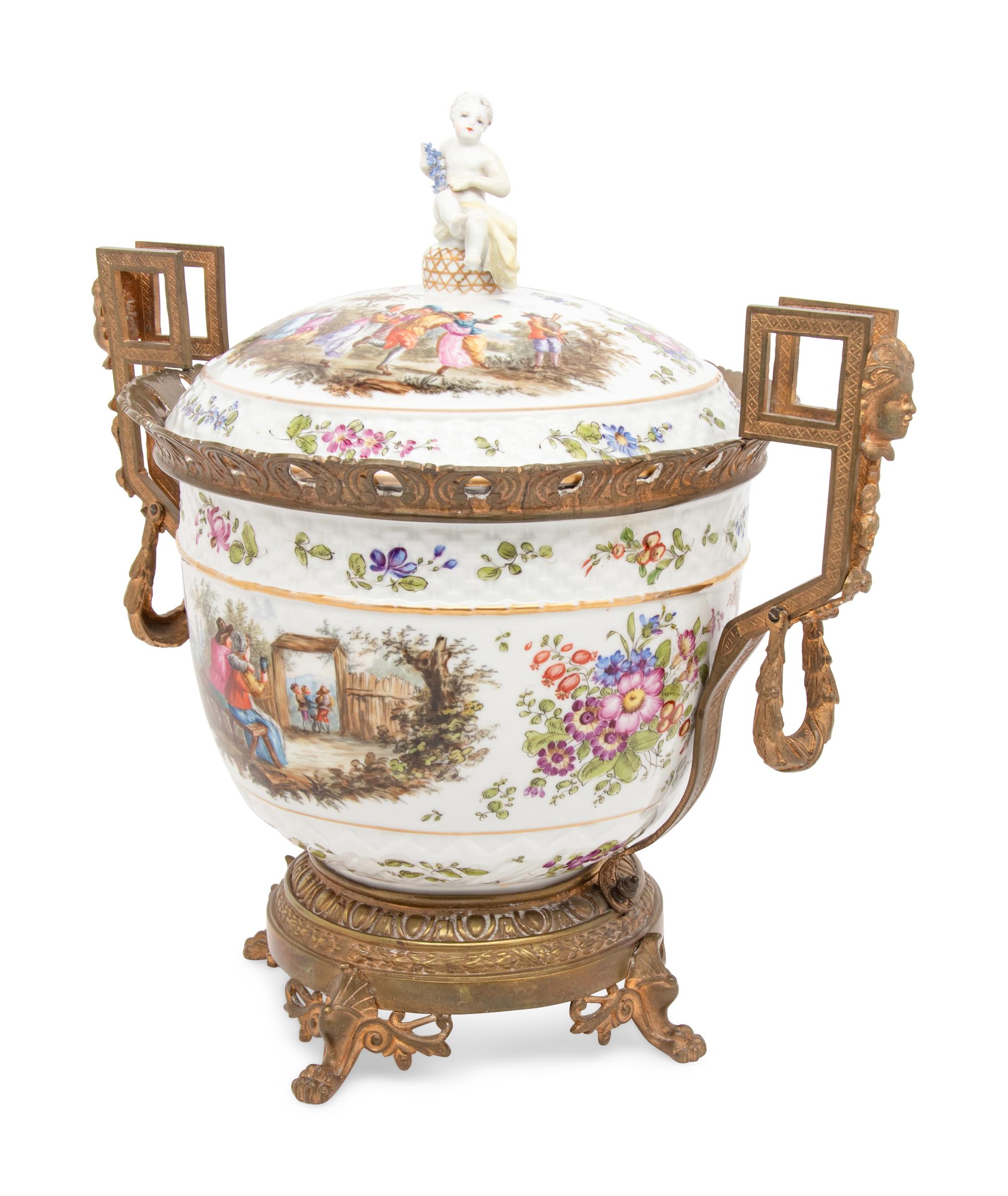 A Continental Gilt Metal Mounted Porcelain Covered Urn