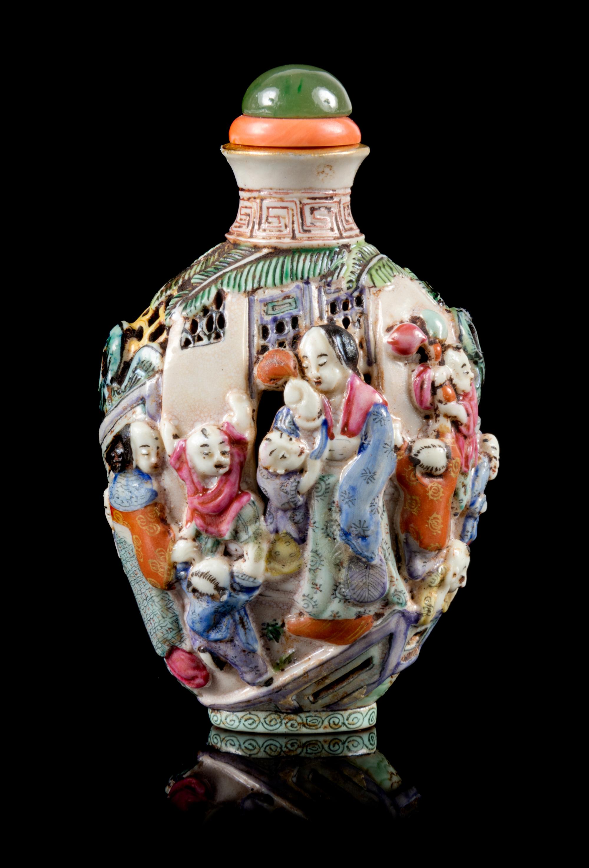 A Molded Famille Rose Porcelain Snuff Bottle Height 3 1/2 inches. — 19TH CENTURY