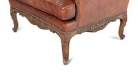 A Pair of Régence Style Leather-Upholstered Wingback Armchairs