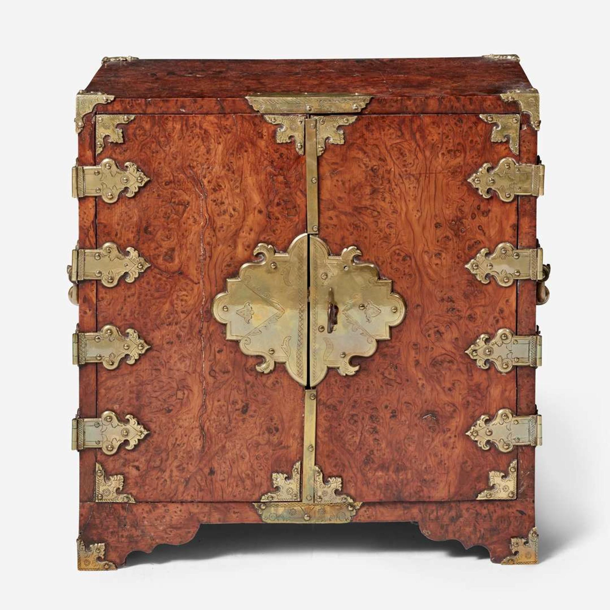 A Queen Anne brass-mounted burl yew table cabinet circa 1710