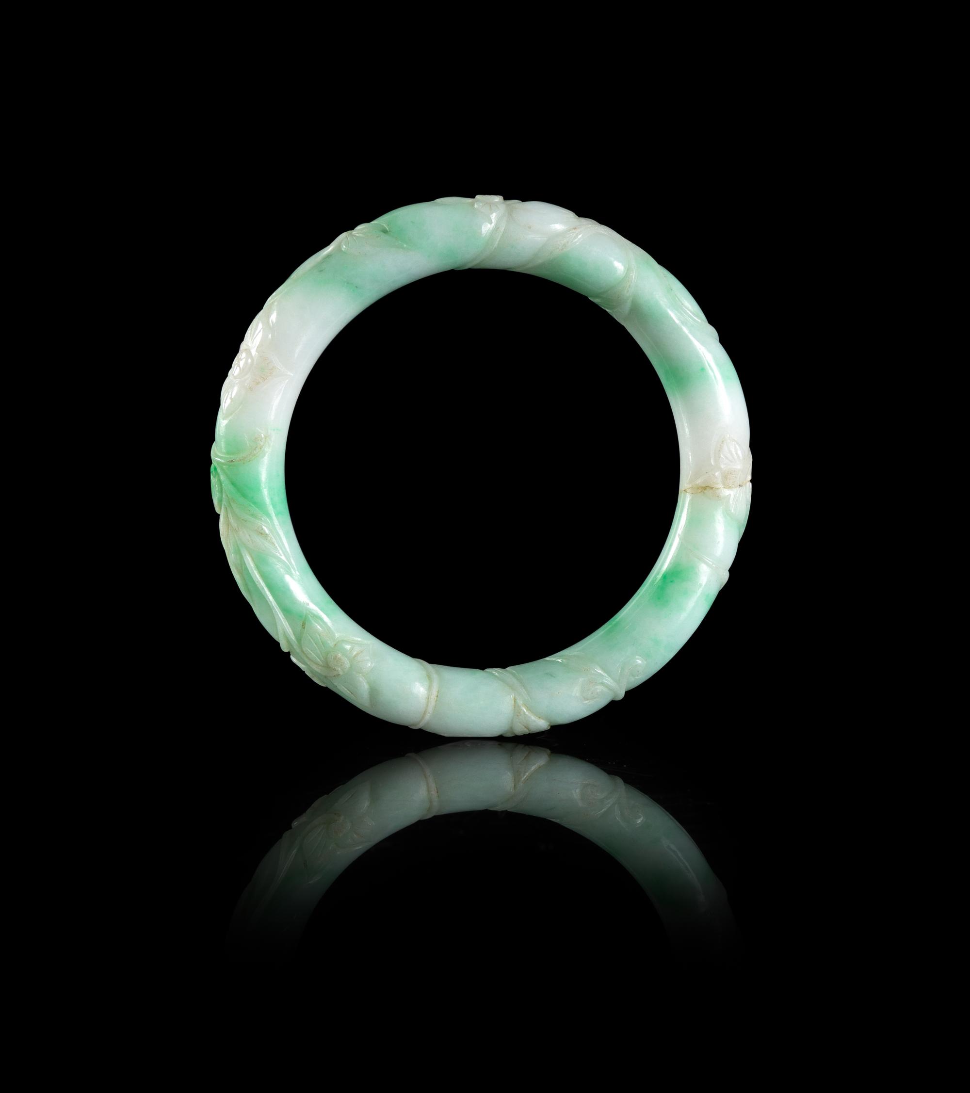 A Chinese Apple Green and Celadon Jadeite Bangle