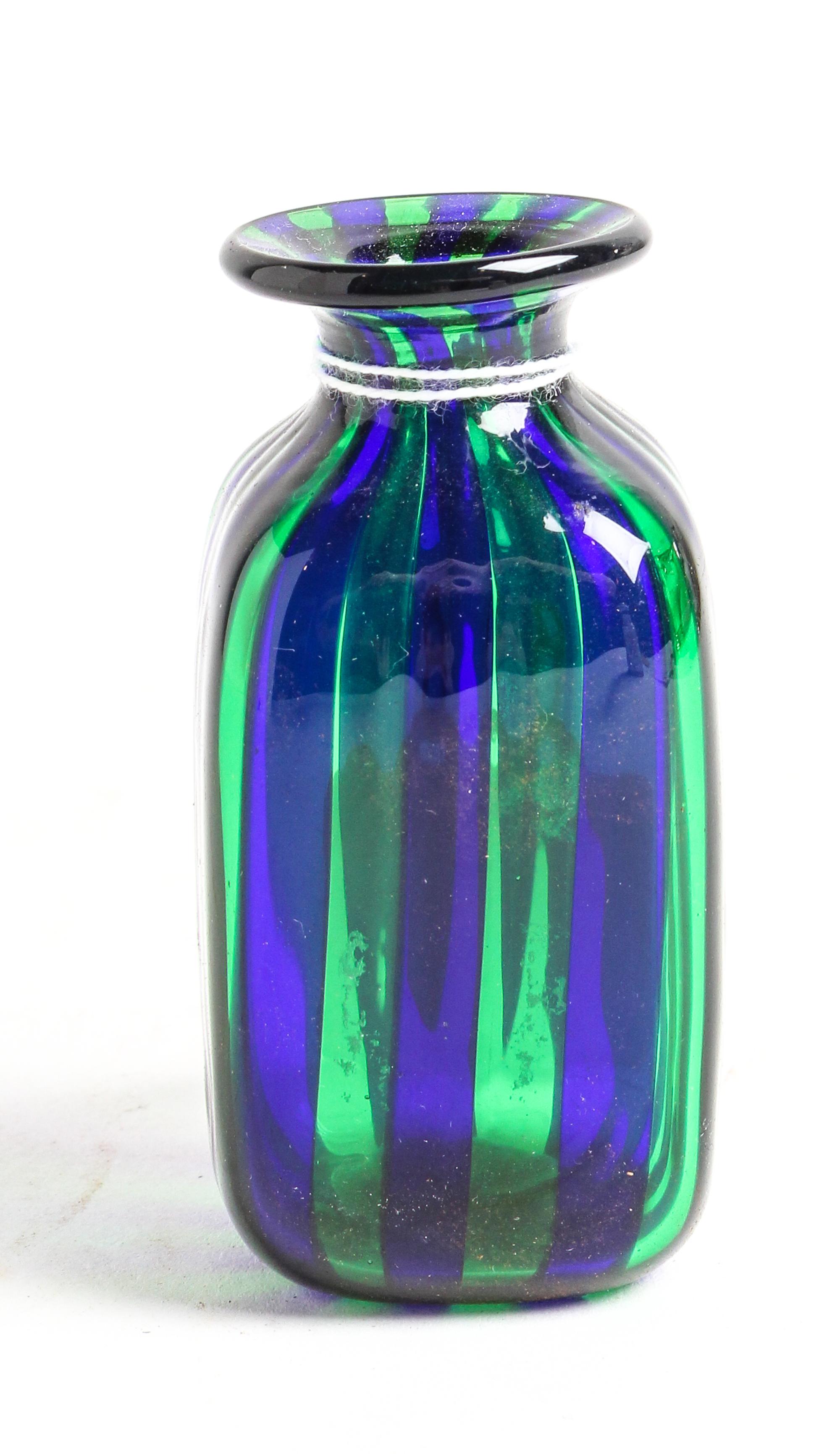 An Iridescent Glass Bottle Height 3 1/2 inches.