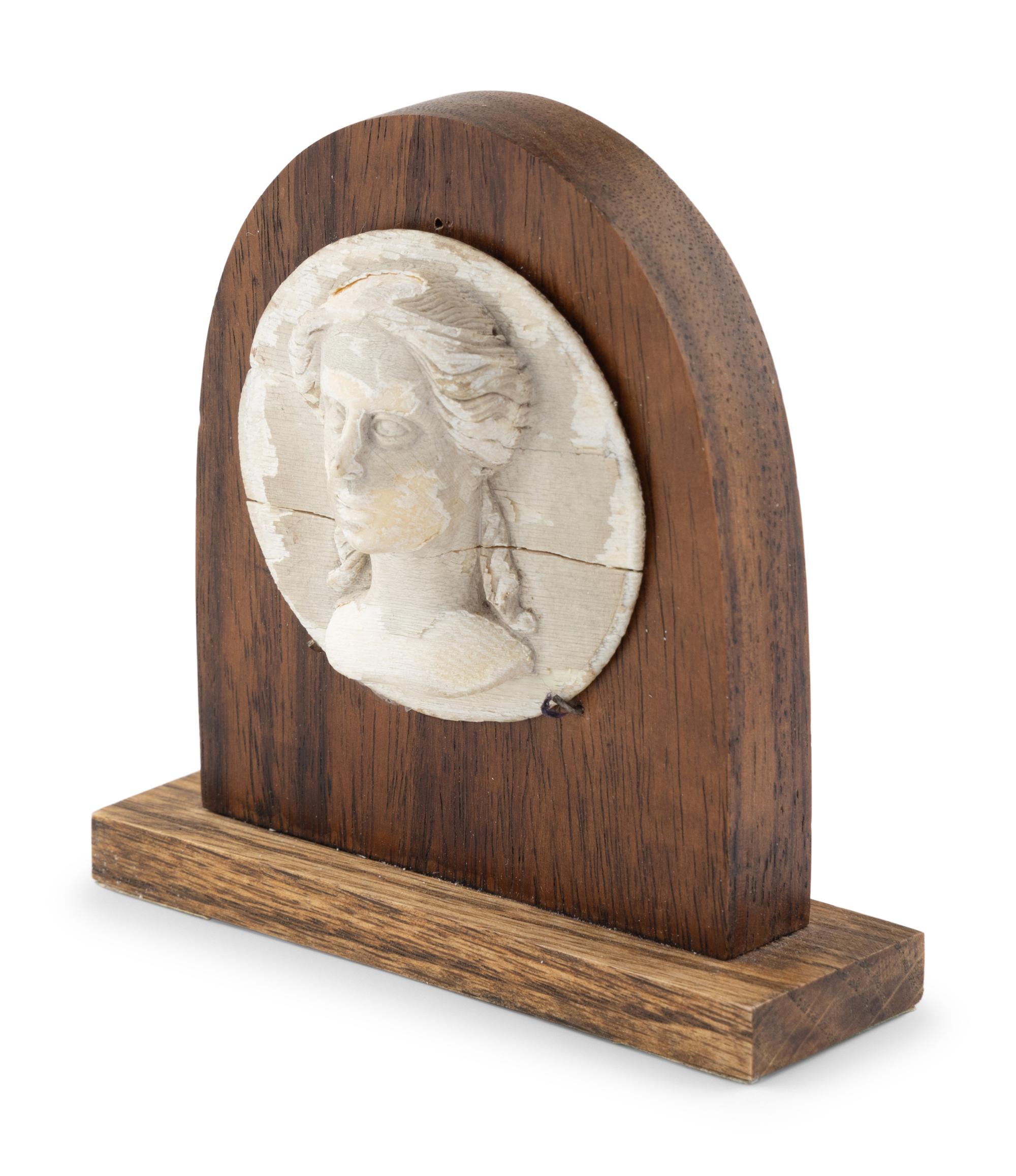 A White Painted Carved Wooden Portrait Relief of a Classical Female