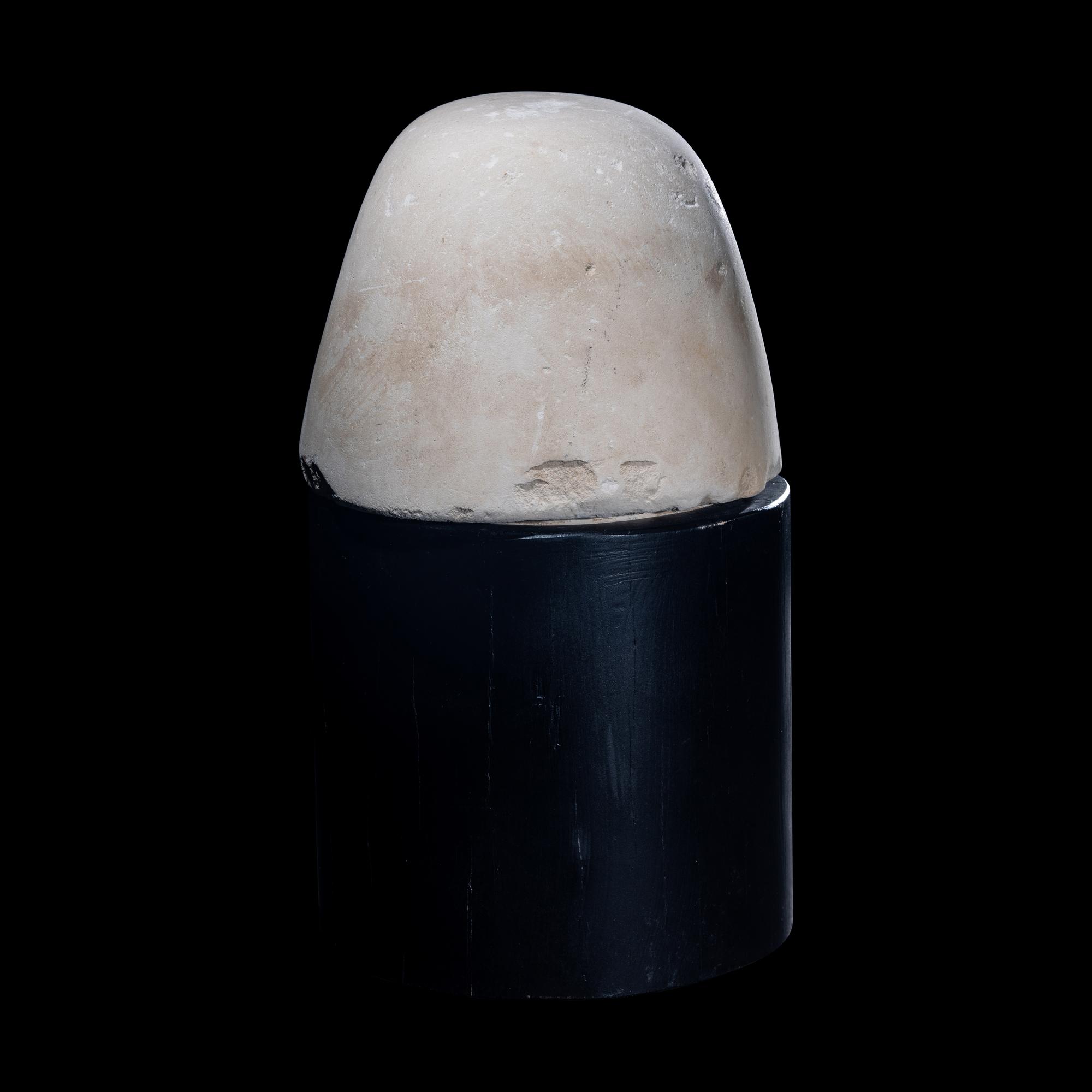 An Egyptian Limestone Canopic Jar Lid