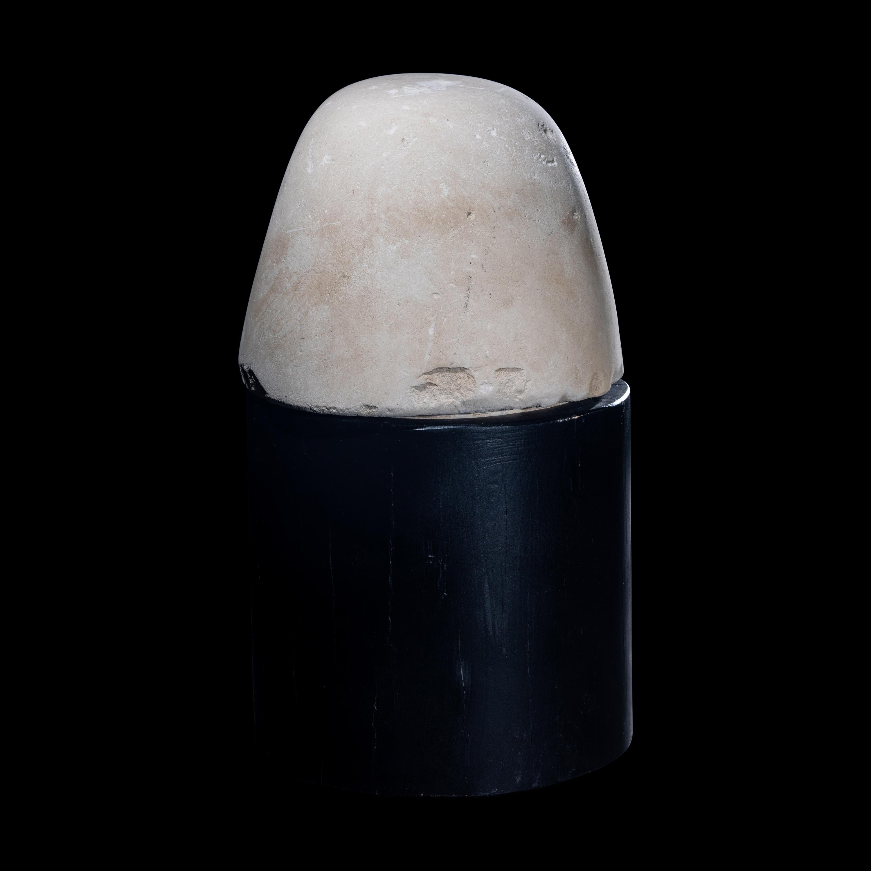 An Egyptian Limestone Canopic Jar Lid