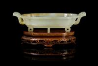 A Chinese Jade Two-Handled Shallow Dish EARLY/MID-20TH CENTURY Width over handles 5 5/8 inches. — EARLY/MID-20TH CENTURY