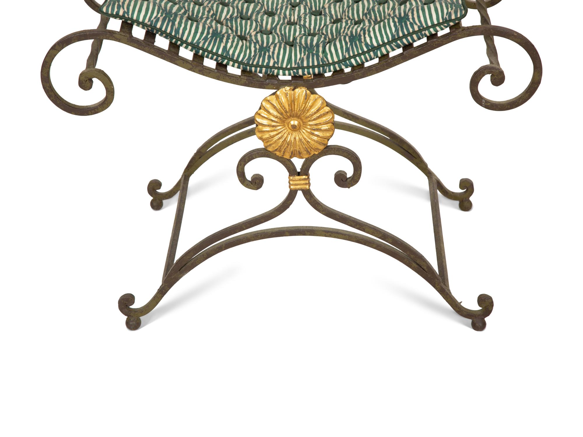 A Pair of Painted and Parcel Gilt Iron Curule Stools with Tufted Cushions