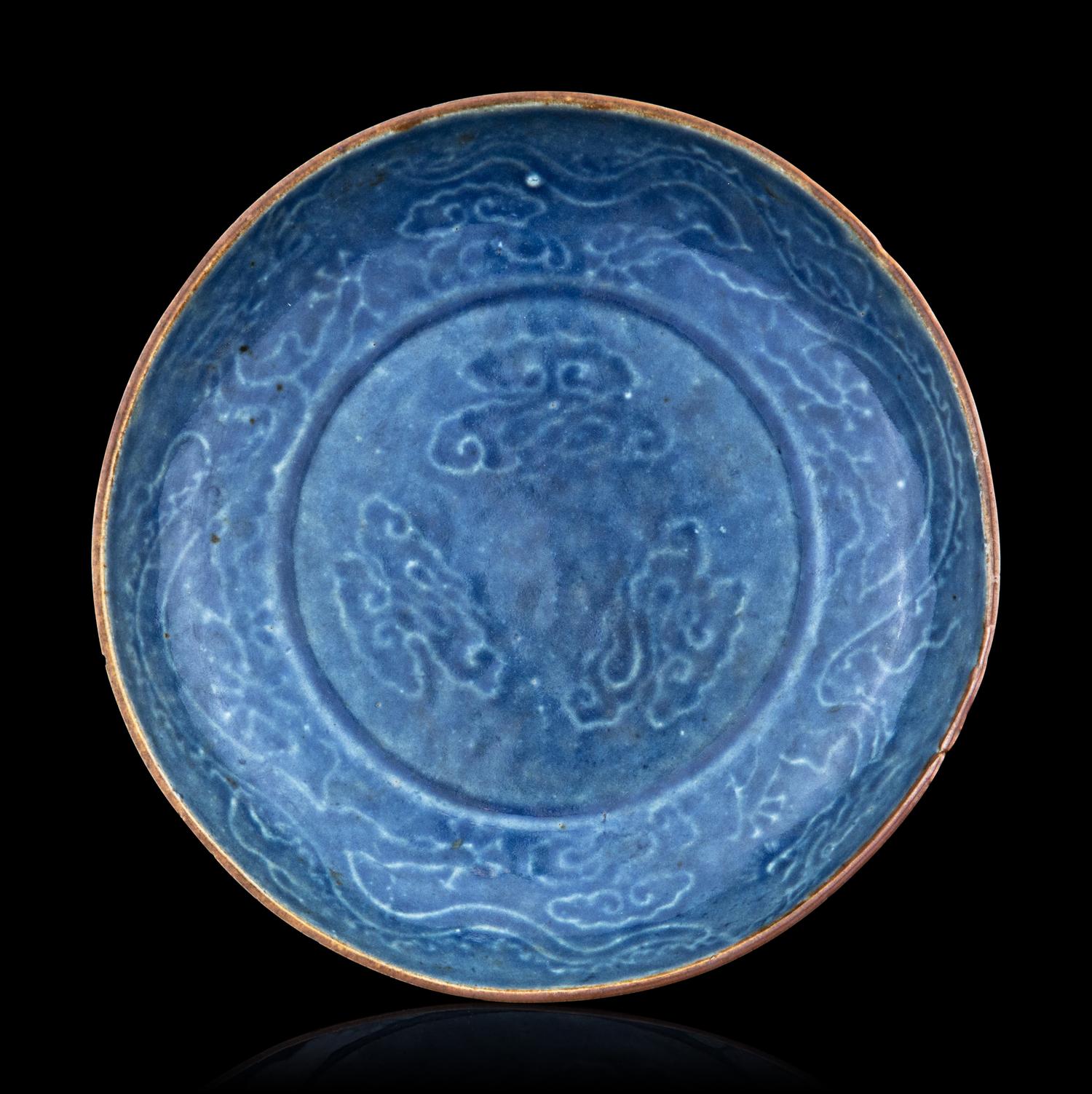 A Carved Blue Glazed Porcelain 'Dragon and Cloud' Plate