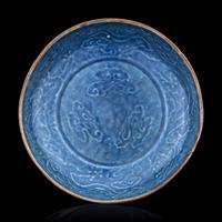 A Carved Blue Glazed Porcelain 'Dragon and Cloud' Plate
