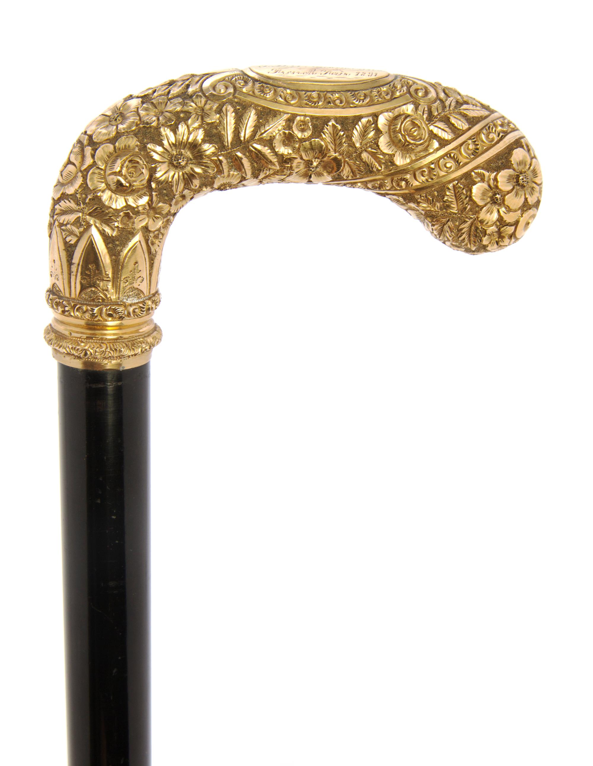 An American Presentation 14 Karat Gold Handled Cane, Length of handle 5 x length overall 34 inches.