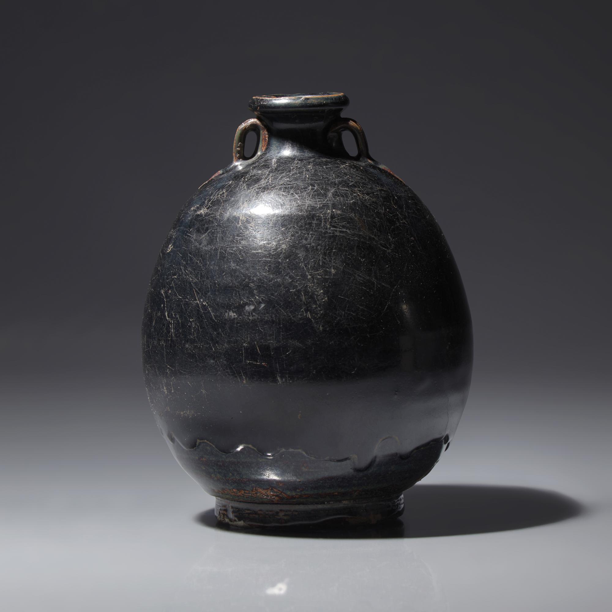 A Chinese Black Glazed Ovoid Jar, Jin/Yuan Dynasty — 金/元 黑釉雙耳罐