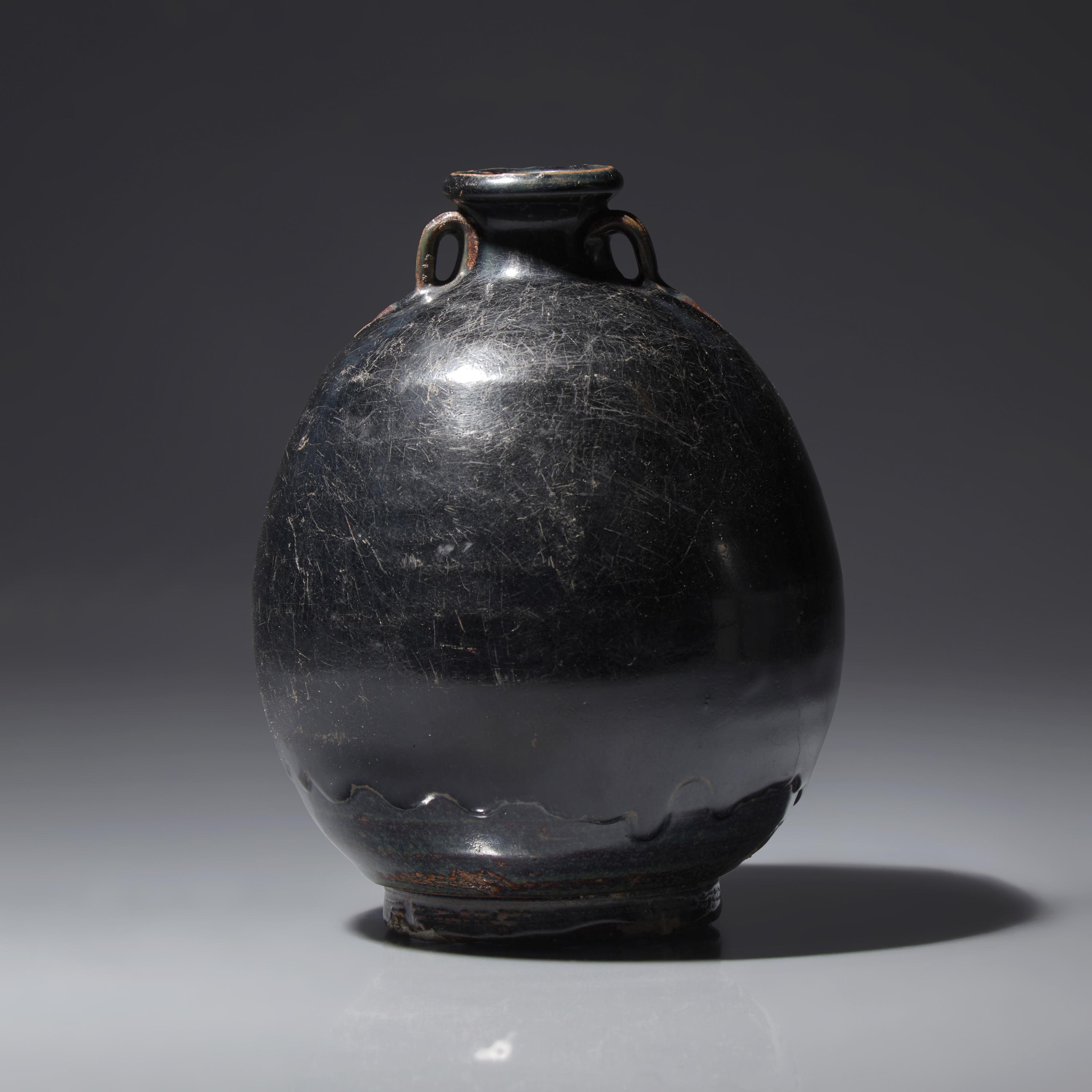 A Chinese Black Glazed Ovoid Jar, Jin/Yuan Dynasty — 金/元 黑釉雙耳罐