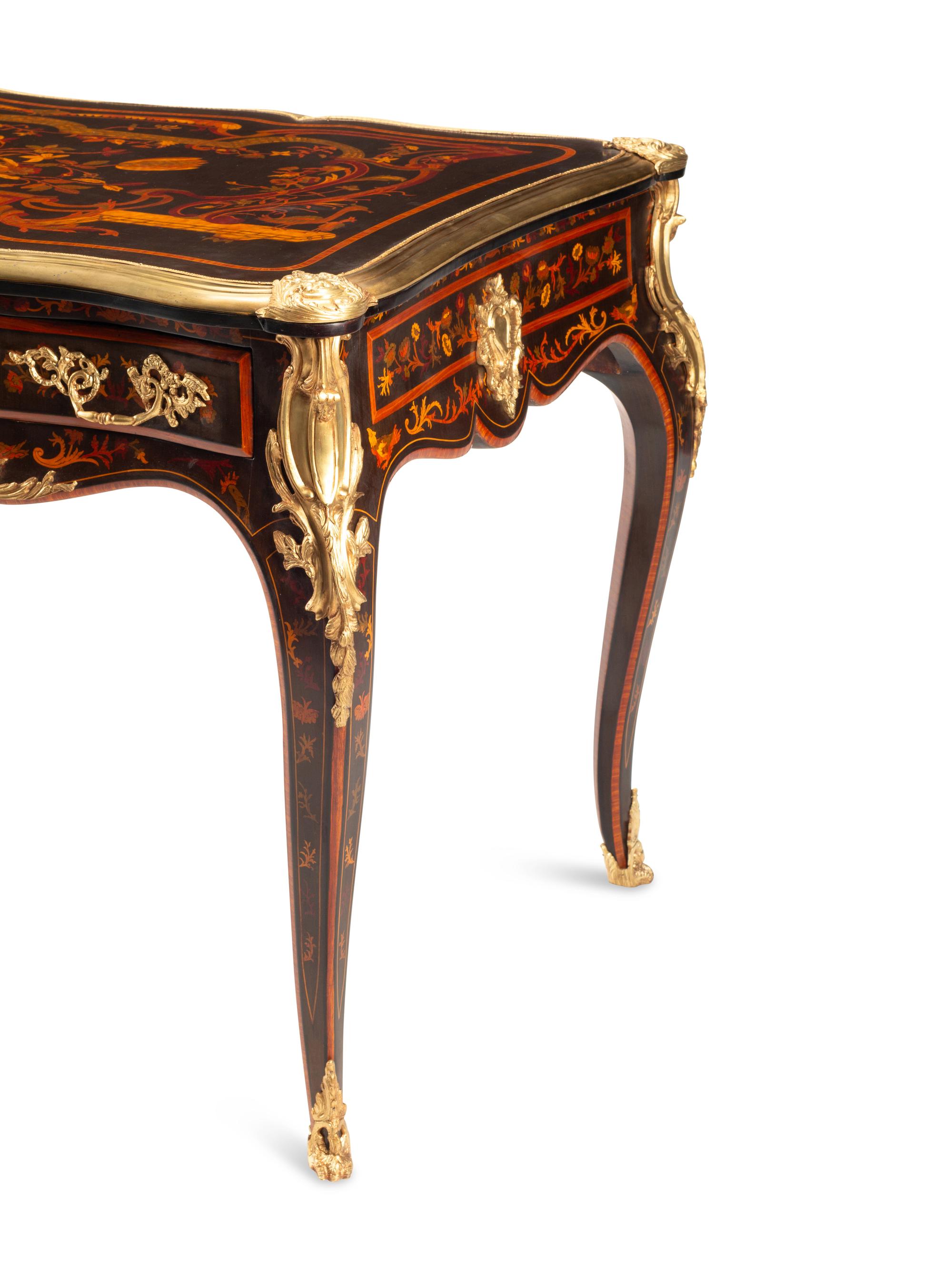 A Louis XV Style Gilt Bronze Mounted Marquetry Bureau Plat