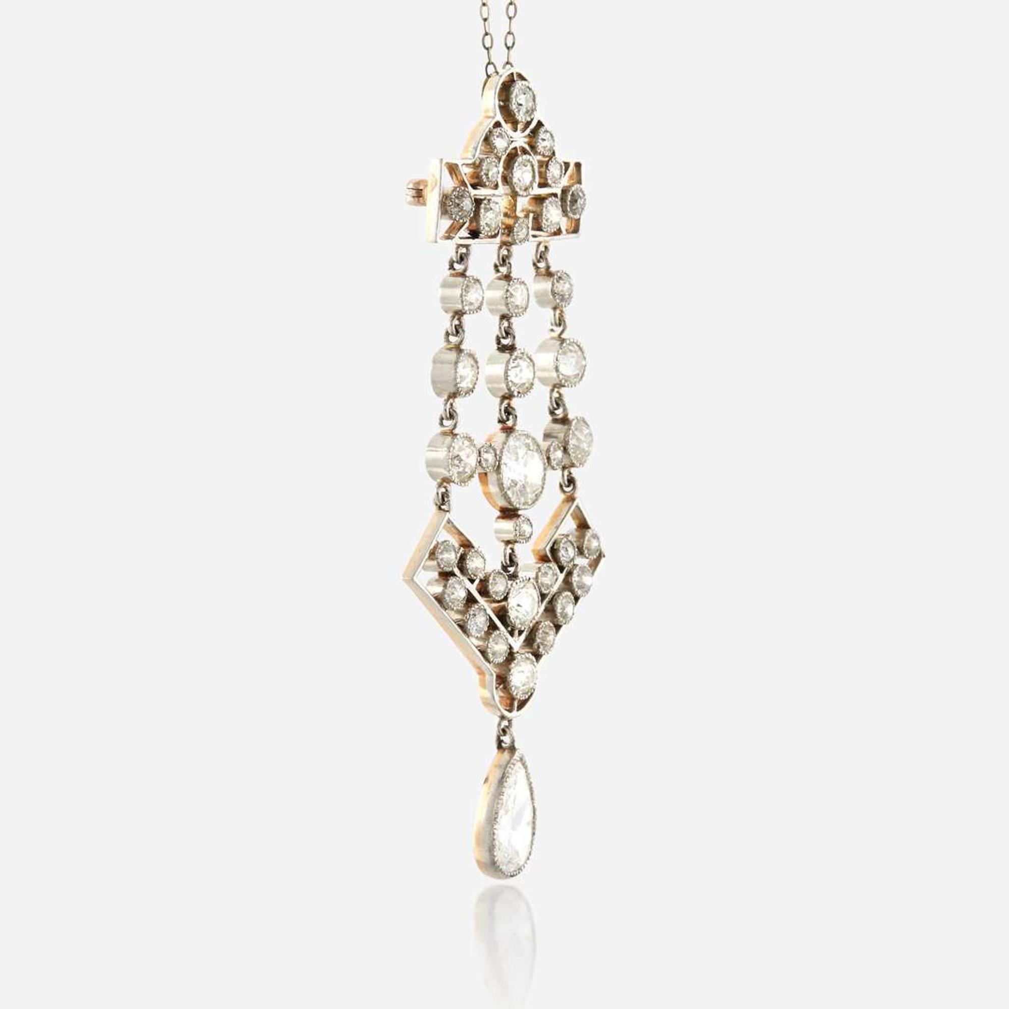 A diamond and platinum topped gold pendant