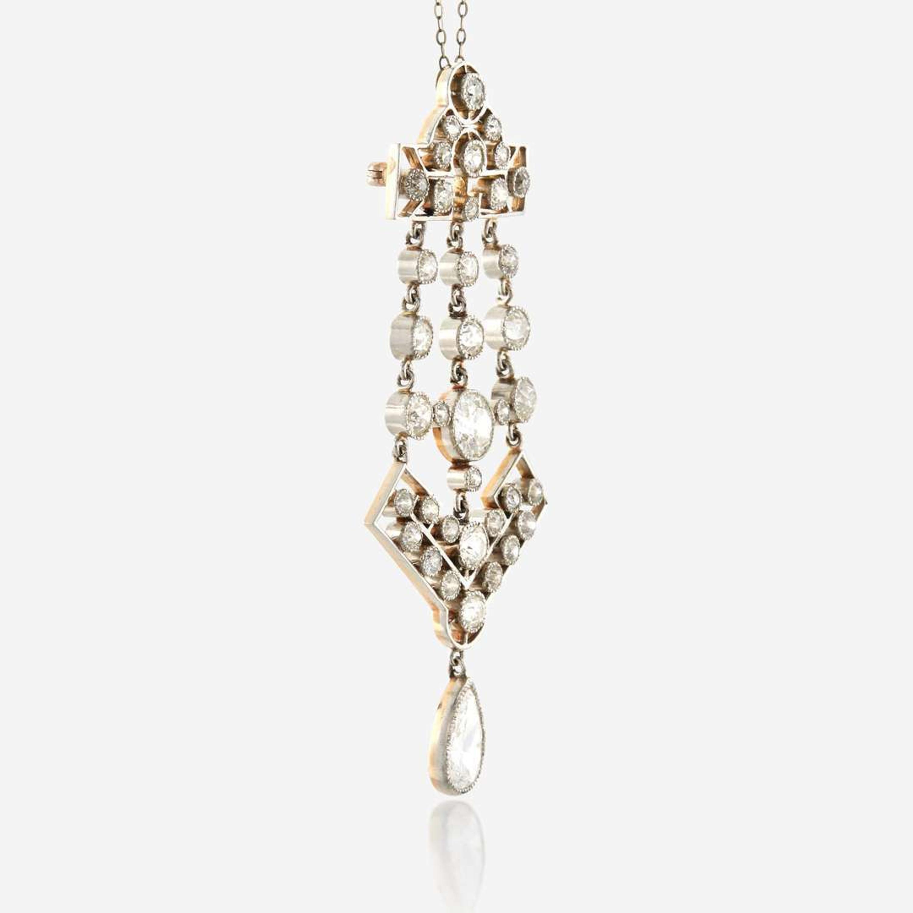 A diamond and platinum topped gold pendant