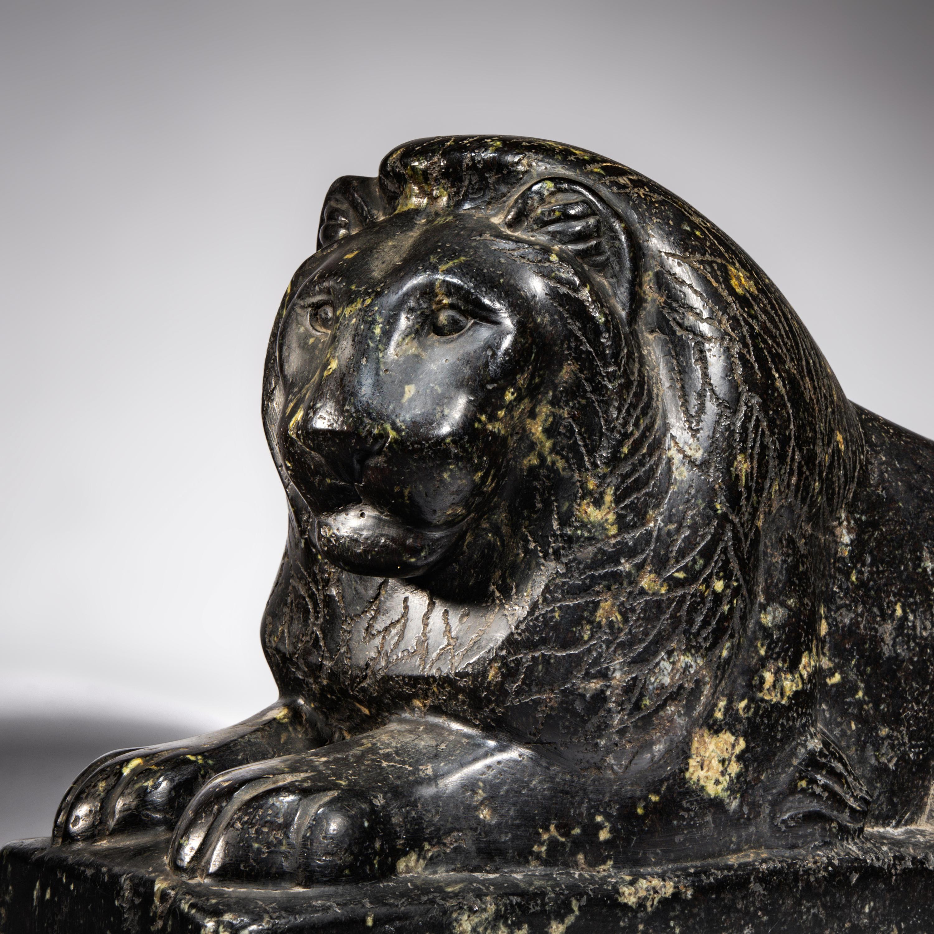 An Egyptian Black Marble Recumbent Lion