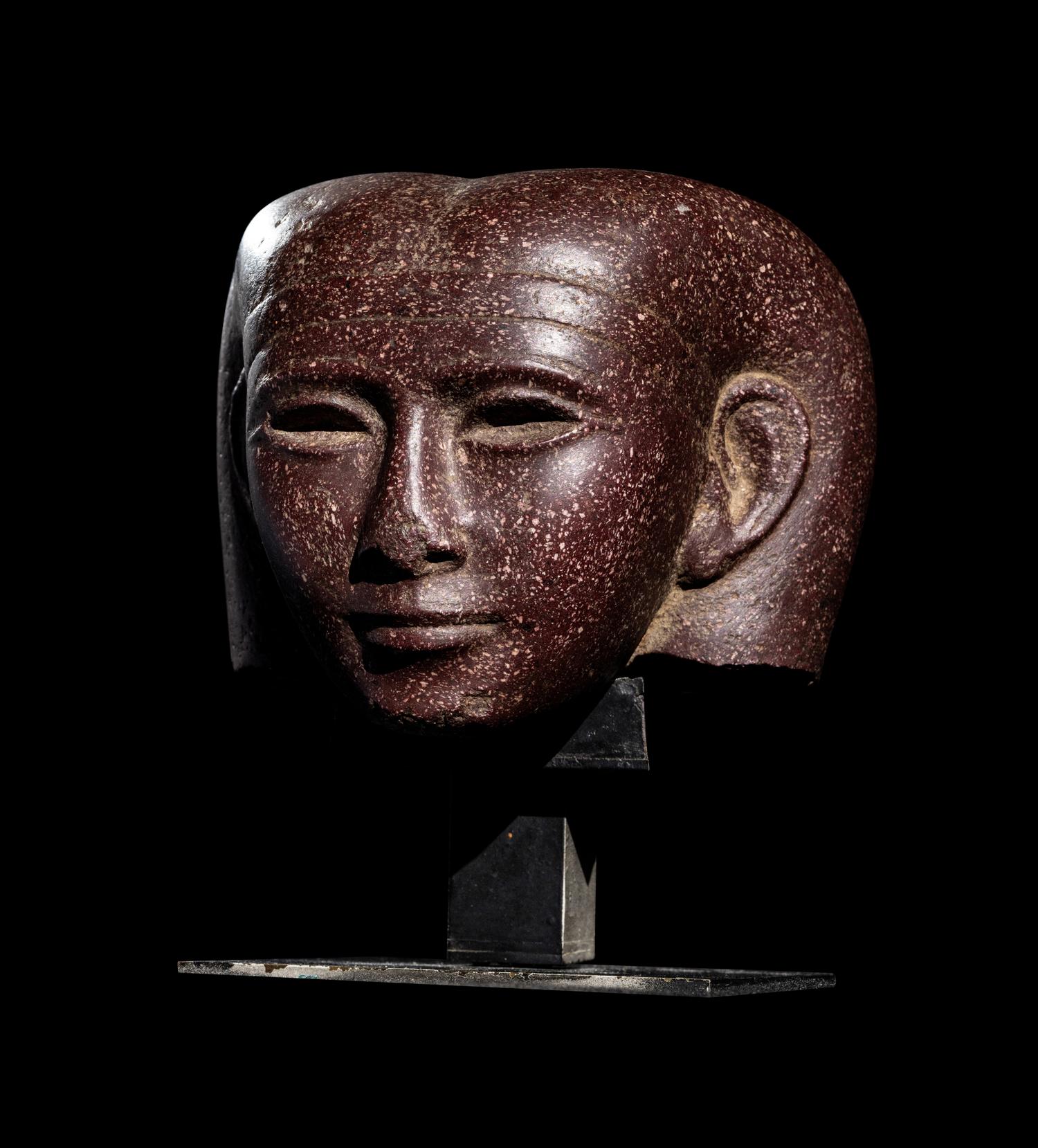 A Roman Porphyry Head of an Egyptian Woman