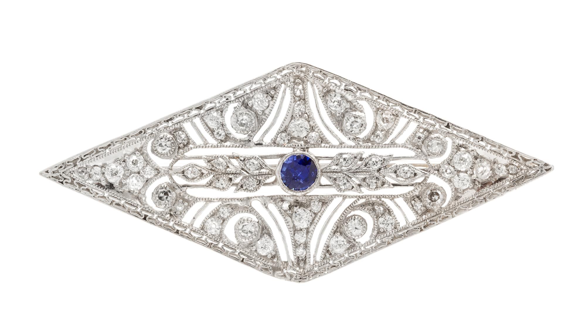 An Art Deco, Platinum, Diamond and Synthetic Sapphire Brooch, 4.80 dwts.