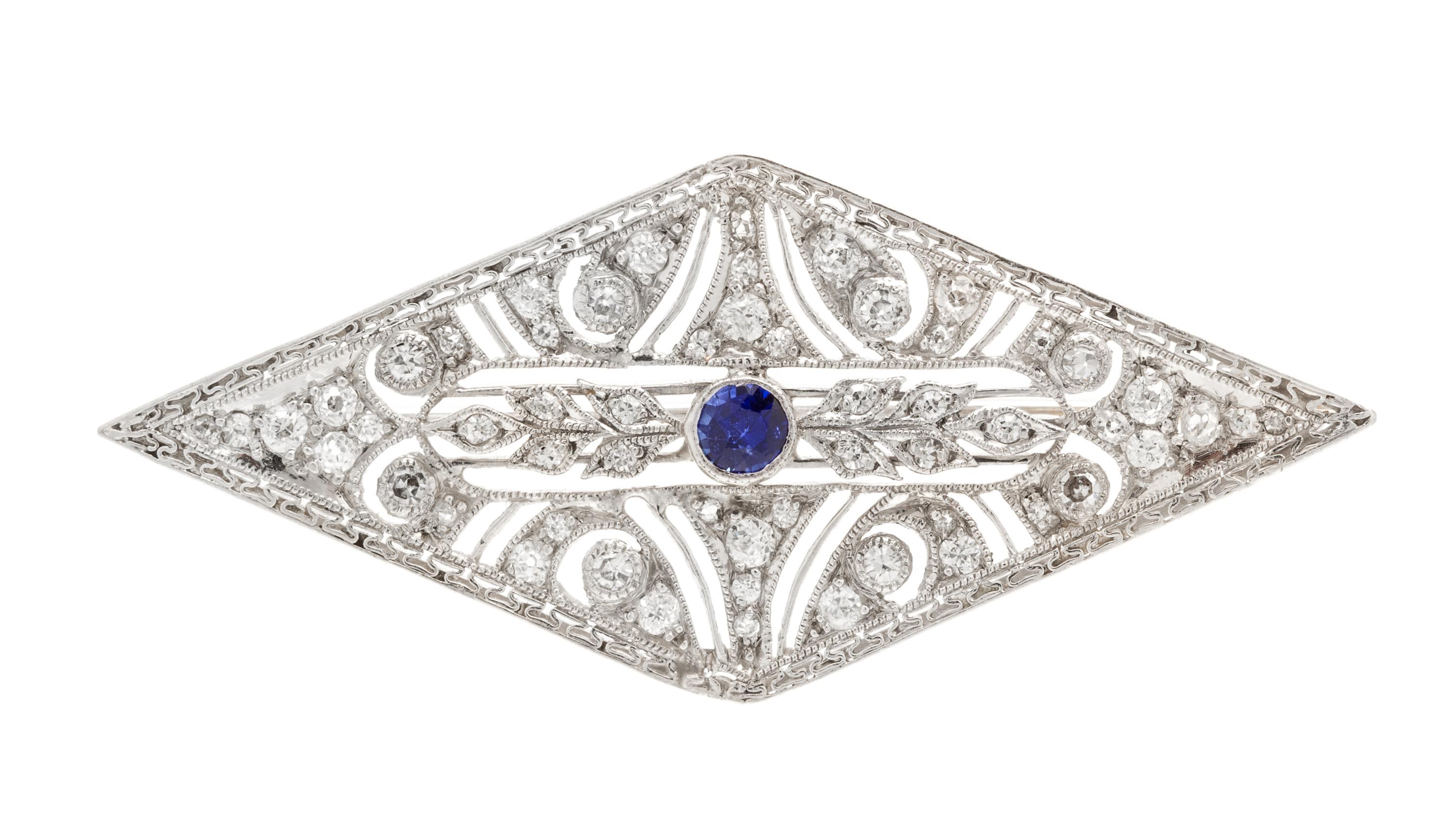 An Art Deco, Platinum, Diamond and Synthetic Sapphire Brooch, 4.80 dwts.