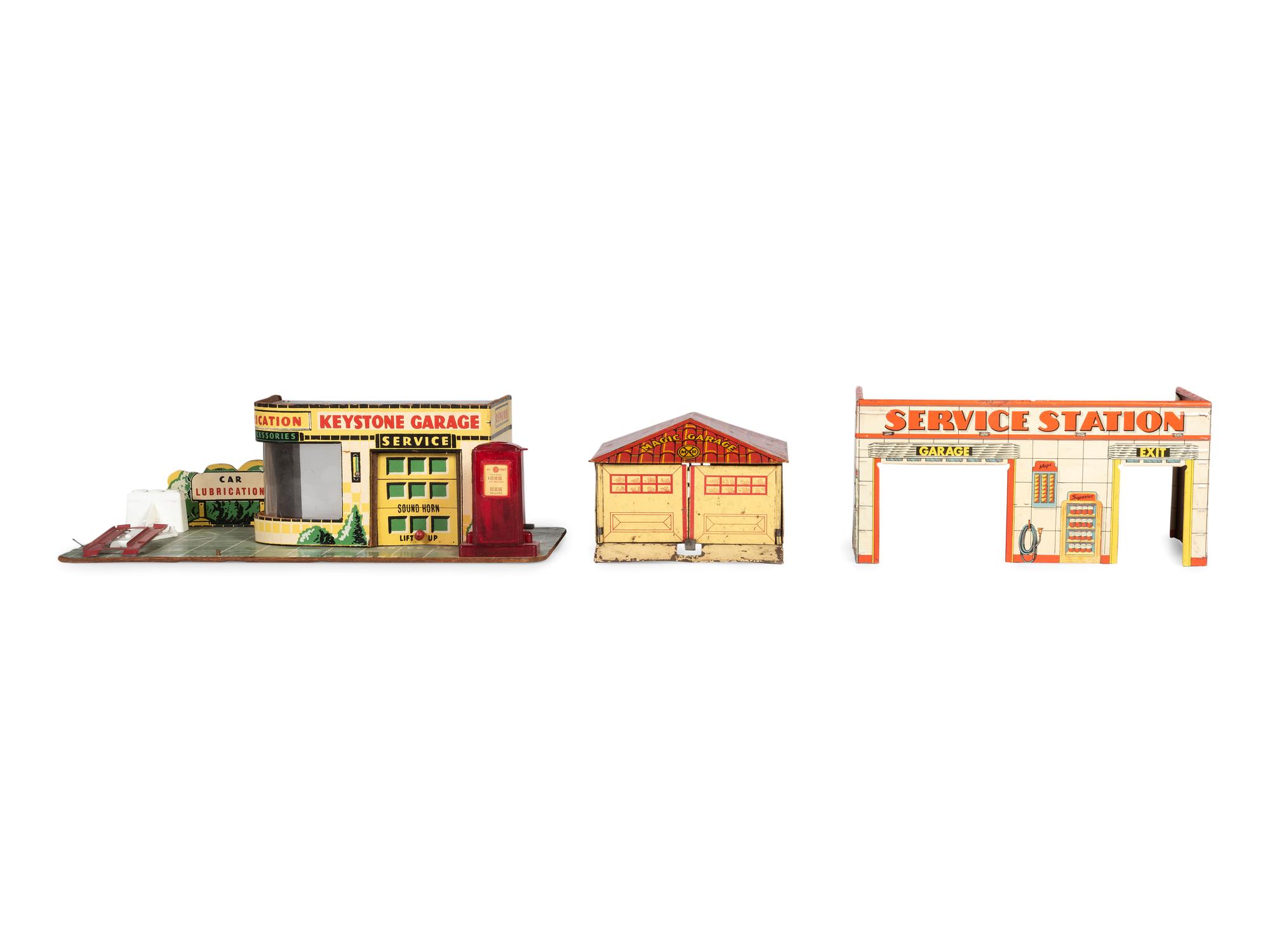A Group of Toy Service Stations and Cars