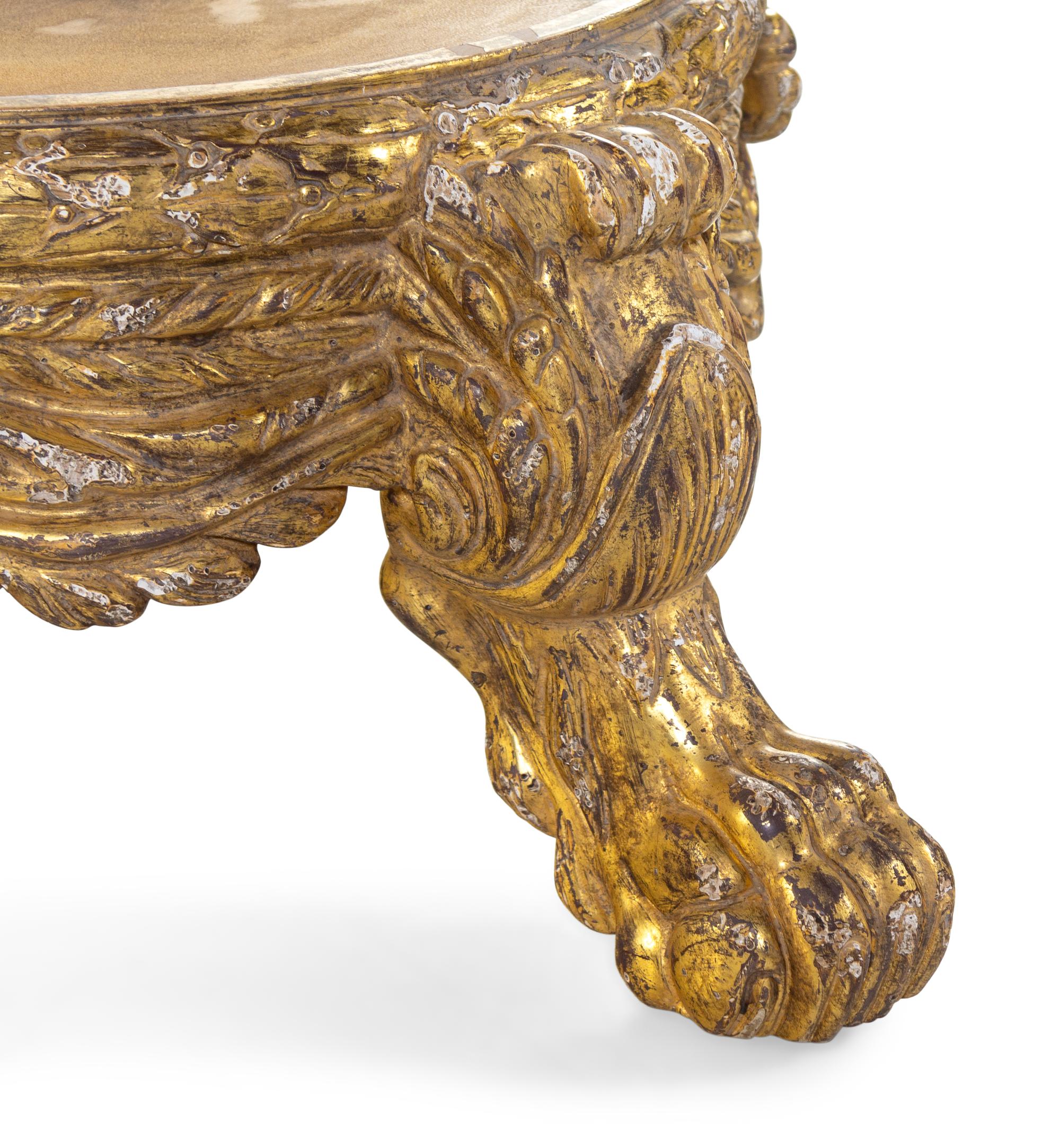 A Cast Stone Jardinière with an Italian Baroque Style Giltwood Base