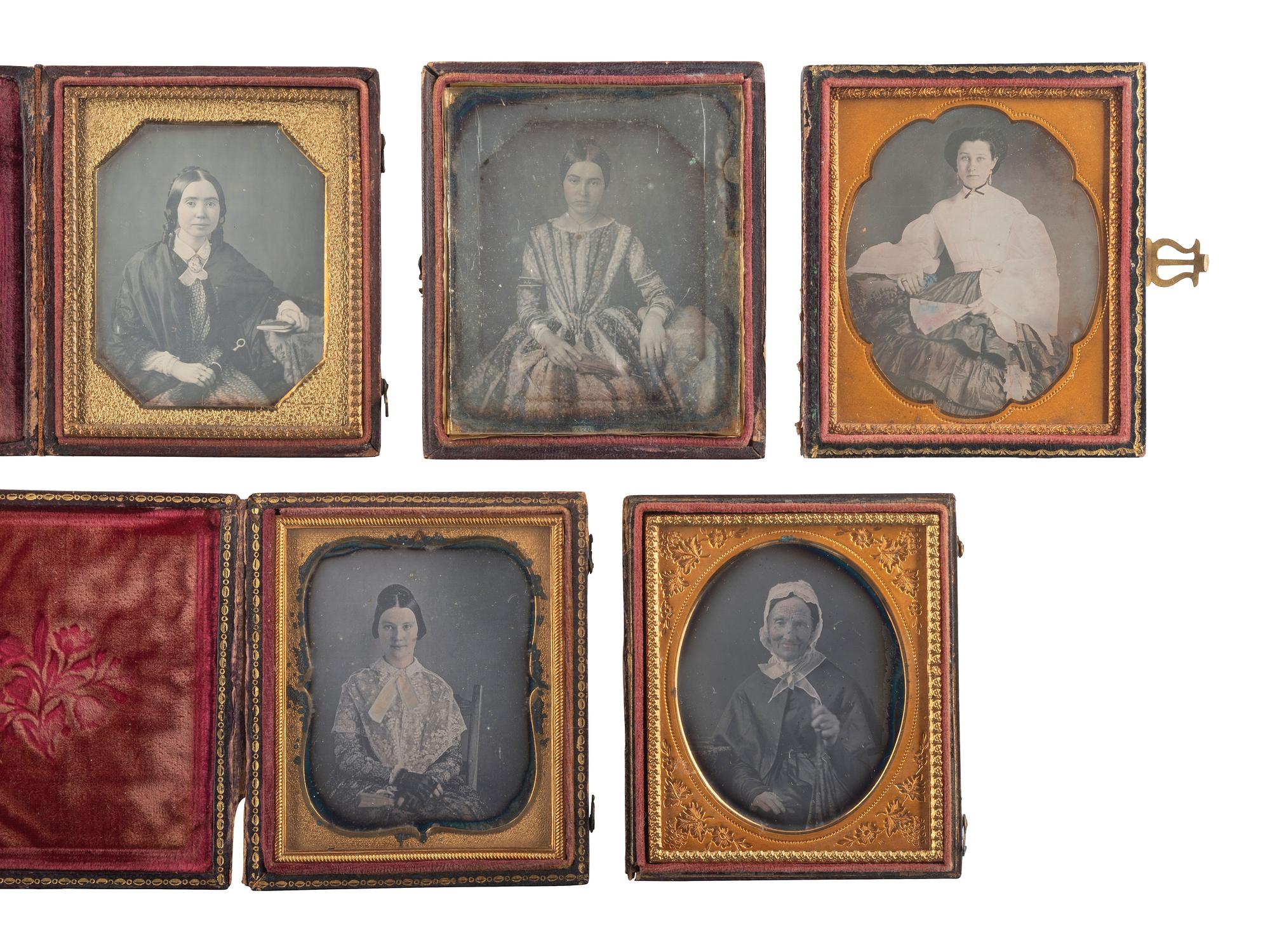 [EARLY PHOTOGRAPHY]. A group of 13 daguerreotype portraits of women holding fans and parasols, highlighted by two half plate examples, including:
